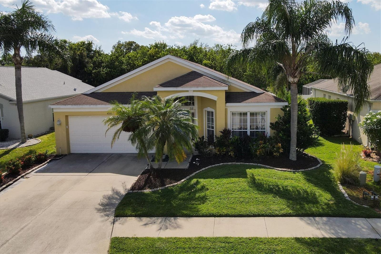 This beautiful home is situated in the amenity-rich SABAL HARBOUR community. Roof & AC only 3 years old!! It features three bedrooms, two bathrooms, and a spacious eat-in kitchen with stainless steel appliances. The kitchen is well-designed with ample drawer and cupboard space, including a convenient lazy Susan, making it perfect for the home chef. There is easy access to the formal dining/living room and family room, both with vaulted ceilings and sliders leading to the screened lanai. The screened lanai is a wonderful spot to enjoy your morning coffee or evening cocktail while overlooking the large partially fenced rear yard, which also has space for a pool. Residents of SABAL HARBOUR can also take advantage of the community pool, playground, tennis courts, basketball court, and clubhouse, offering plenty of amenities to support an active lifestyle in sunny Florida. In addition to the community amenities, SABAL HARBOUR is conveniently located near beautiful beaches and the UTC Mall, which is filled with a variety of shops and dining options. There is so much to enjoy both within and around this fantastic home!