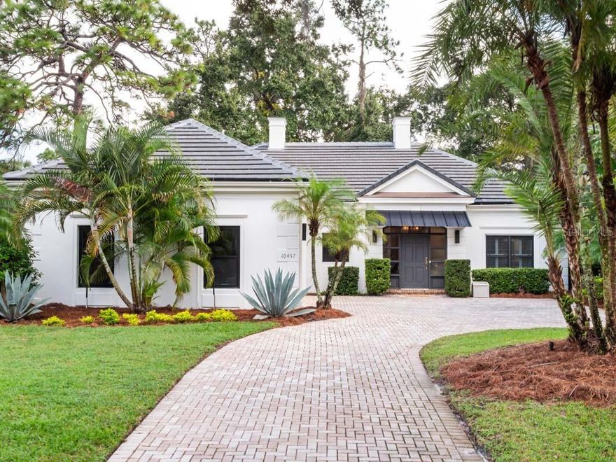 One or more photo(s) has been virtually staged. With four bedrooms and four full bathrooms, this single-story home offers a peaceful retreat within close proximity to Lake Nona Golf & Country Club’s outstanding member amenities. Expertly renovated with elevated materials, a new roof and more than 600 square feet of additional living space, this French Provincial style home features an open floor plan and a contemporary interior flooded with natural light. The great room offers large floor-to-ceiling windows and French doors overlooking the brand-new sunroom, to be completed with stacked sliding doors, allowing for seamless interior to exterior flow. Anchored by a newly expanded chef’s kitchen, the dining and living spaces complete the main area of the home. Surrounding the great room are four en suite bedrooms, with newly remodeled bathrooms, including the primary suite which features a new walk-in closet and spa-like bathroom retreat with an oversized, glass-enclosed shower and private water closet. The home site offers an opportunity to create a custom outdoor living experience in the private, fenced backyard. Additional features include: • Interior laundry station • Two-car garage with EV charging, overhead storage and an air-conditioned closet