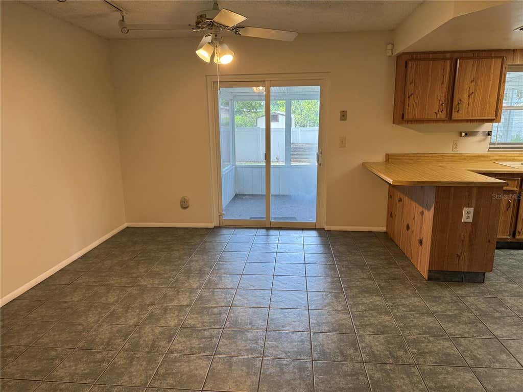 Photo of 4010 Woodsong Drive, Orlando, FL 32817 (MLS # O6420804)