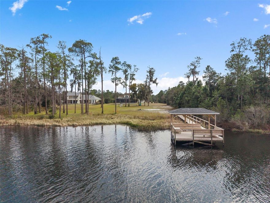 Private 5-acre lakefront estate in the gated community of Lake Hendon Reserve with over 160 feet of frontage on a spring-fed lake. Designed to maximize water views and outdoor living, the property features a newly constructed 2025 saltwater pool with 25-foot sun shelf, 16-person spa, marble pool deck, and a renovated 2025 private dock providing direct access for boating and fishing.

Located minutes from Lake Nona’s Medical City with convenient access to Narcoossee Road, USTA National Campus, SR 417, and Orlando International Airport.

Double glass entry doors open to interiors with double crown molding, 5-inch baseboards, and lake views from multiple living areas. The kitchen includes quartz countertops, oversized island with seating for six, custom cabinetry, double ovens, gas cooktop with pot filler, additional prep sink, added electrical outlets, and stainless steel appliances overlooking the water.

The family room with gas fireplace opens to a covered rear porch pre-plumbed and vented for a future outdoor kitchen. The primary suite is privately positioned in the east wing with lake views and direct porch access. The primary bath includes dual vanities, walk-in closet, and oversized shower with dual shower-heads.

Additional spaces include a dedicated home office, upstairs loft, downstairs guest bedroom, two additional upstairs bedrooms, and a 700-square-foot bonus/flex room suitable for media, game room, or additional bedroom.

Four-car garage with extended depth, insulated and climate controlled with heating and air conditioning, plus motorized garage screens. Dual HVAC systems replaced in 2021. New 2025 whole-home water filtration system, including reverse osmosis filter at the kitchen sink. Low-E windows and radiant heat barrier.



Video tour available.