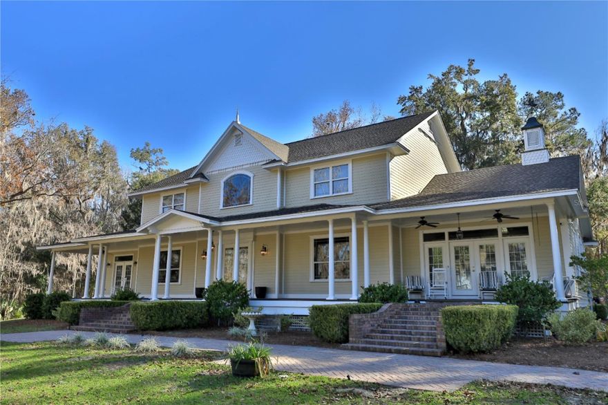 Located along HWY 225 in one of the most desirable equestrian corridors in NW Marion County, this remarkable 109.29+/-acre estate offers a rare blend of high elevation, craftsmanship, and versatility. The two-story residence commands serene views of a picturesque, stocked pond and rolling acreage, creating a setting that feels both private and enduring.
This estate features 5 bedrooms and 3.5 baths, with the first floor being the heart of the home, providing a spacious 2-story ceiling height, with a grand central sitting gathering room, fireplace, and well-appointed bar, making it an exceptional space for hosting, entertaining, or enjoying game days with family and friends. The primary suite is designed as a true retreat. The suite offers a fireplace and a luxurious bath.  The formal living space is perfect as an office or sitting room, and the formal dining room adds timeless elegance and flexibility for both everyday living and entertaining.
Throughout the home, custom woodwork sets this residence apart, with handcrafted moldings, doors, and detailed finishes personally created on-site by the owner, a master carpenter, giving the residence a level of character, quality, and authenticity.  A detached three-car garage and a fully equipped 2-bedroom, 2-bathroom guest house provide ideal accommodations for extended family, guests, or staff.  
The property is further enhanced by three large equipment buildings, well-suited for equestrian operations, agricultural use, a business owner, corporate investor, car enthusiast, or simply seeking a serene retreat with all the amenities. This property offers endless opportunities. Whether your passion is horses or cattle, the farm offers room to ride, train, and raise horses or cattle.  The property is perimeter-fenced, providing ample parking for horse trailers, recreational vehicles, or a car enthusiast's collection.
With its exceptional acreage, prime highway frontage, elevated setting, and proximity to Ocala’s world-renowned equestrian destinations, 13 miles to The World Equestrian Center, and 13 miles to HITS, this estate represents a legacy opportunity in the heart of horse country, perfectly suited for a private retreat, equestrian enterprise, or investment holding. Don’t miss out on this unique chance to own a piece of paradise!