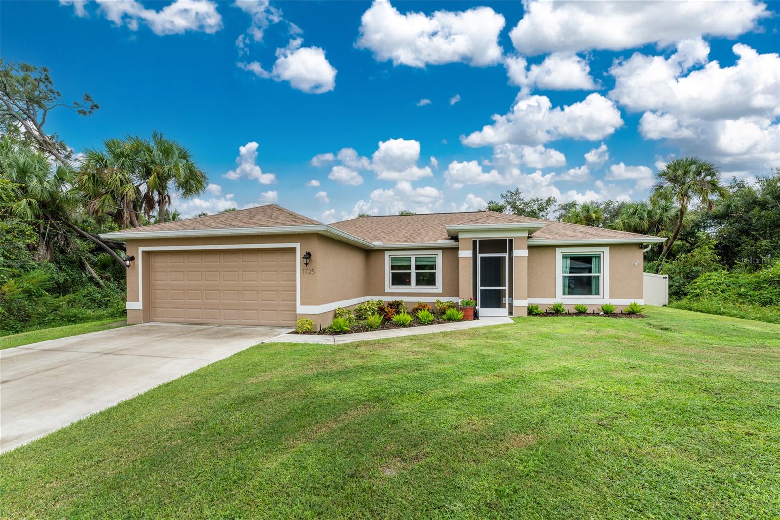 Check out this stunning 3-bedroom, 2-bathroom home, built in 2020! It features an open, split floor plan with vaulted ceilings, IMPACT windows, and tile flooring throughout. The kitchen is ideal for entertaining, with soft-close white cabinets, granite countertops, and stainless steel appliances. There's ample counter space and an eat-in island for casual dining. The spacious Master suite offers a walk-in closet, a double sink vanity, and a tiled shower. The guest bedrooms are located on the right side of the home, sharing a well-appointed bathroom with a tiled shower/tub combo. You'll also find a indoor laundry room with storage cabinets leading out to the garage. The screened front entry and patio allow you to open up the house on breezy days. The exterior is complete with a tan vinyl FENCE, a storage shed, SPRINKLER SYSTEM, and Ring SECURITY system. This home is nestled in a prime North Port location, close to grocery stores, hospitals, entertainment options, and easy highway access.