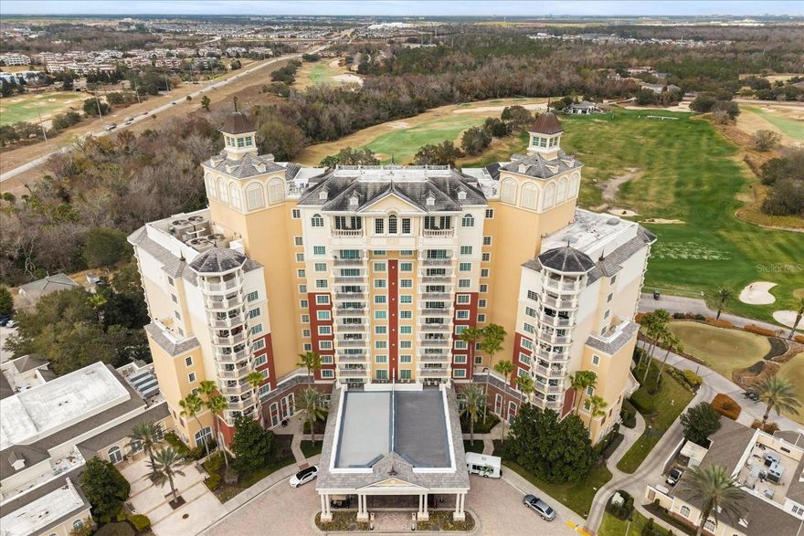 Own on TOP OF THE WORLD  at Reunion Resort.  This 10th floor unit overlooking the Golf Driving Range and Disney will provide endless evenings of viewing pleasure for the nightly FIREWORKS at Disney.  Comfortably decored and immersed in amenties at Reunion Grande this condo complete with TRANSFERRABLE MEMBERSHIP and FULLY FURNISHED.  Already in the Reunion Rental program which allows for as much personal usage as you desire or offset some of the costs of ownership at your discretion.  Walking distance from so many amenties, many of which are in the same building including a ROOF TOP POOL, 3 Restaurants, a COFFEE shop and short walking distance to the PALMER/WATSON clubhouse and Fitness center located at Seven Eagles.  Please call today and schedule as this won’t last long.