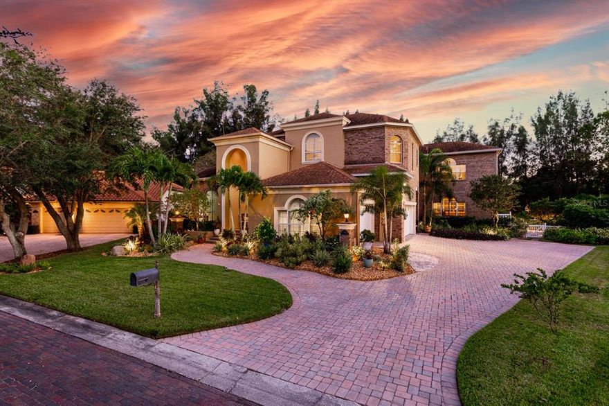 Standing on the crest at the end of a private cul-de-sac in the small, exclusive gated Waterford Court community, is this custom Executive Waterfront Home. On over ½ acre and 200 feet of protected water frontage with access to Tampa Bay & the Gulf of Mexico, this home is completely surrounded by mature Florida-friendly landscaping. Through double front doors, the spectacular entry opens into a grand foyer with soaring ceilings, formal living, and dining rooms. A stately home office, powder room and coat closet with hidden under stair storage, complete the front section of the first floor. Proceeding to the rear you will find the heart of the home. The open sunny family room with warm wood floors, a wall of glass French doors & a cozy gas fireplace flows out to the pool deck. Behind the family room is a game room with full pool bath. It could be a 5th bedroom or live-in quarters for an au pair. A large home theatre, with tiered flooring, is right behind the kitchen. The 5,533 sq ft floor plan is thoughtfully designed, the perfect combination of spaces - formal and relaxed, social and private. The Gourmet Kitchen is a fully appointed cook's dream featuring top of the line appliances, a Thermador 6-burner gas cooktop, GE Monogram built-in refrigerator, Double ovens, warming drawer, Wine cooler, custom cabinetry, abundant prep areas and a breakfast/homework bar.  The sunny breakfast nook is the perfect spot for casual family meals. Panoramic views from the family room/kitchen areas overlook the wooded back yard with swaying Australian pines and mangroves beyond the pool deck. Equally attentive to the outdoor Florida lifestyle is the screened lanai soaring over 25 ft above the totally private resort style pool and heated waterfall spa. It is the focal point of this beautifully landscaped space. A fabulous outdoor kitchen makes entertaining easy. Nestled in mature landscaping is an inviting fenced-in backyard that family and pets will enjoy. A paver walkway leads out to the dock. Keep your eyes open for Manatees, Snook and Mullet hiding in the shade of the dock. Back inside at the top of the elegant stairway, you'll find the spacious master bedroom suite, 3 more bedrooms and 2 more full baths. The master suite is a luxurious haven with over 1200 sq ft. It has  a warm cozy fireplace, sitting area and large private 2nd story balcony overlooking the pool with direct pool access via a spiral staircase. An equally spectacular master bath features a beautifully contoured free standing soaking tub, 2 head shower, private water closet, dual vanities and a walk-in closet. Beyond the bath is a sizable bonus room perfect for a nursery, exercise room, craft room or another home office. Custom Plantation shutters, exquisite millwork and built-in custom cabinetry adorn this home. Even every-day features, such as the laundry room, epoxy coated 3 car garage floor and a pull-down stairway to a floored attic are spectacular. This home has been lovingly & immaculately maintained. No mechanical worries, the AC, water heating & water softener systems were recently replaced. Conveniently located just a bike ride away from vibrant downtown St Pete's waterfront with endless dining, shopping, world class museums and events, and just a short drive to white sugar sand beaches and Tampa International Airport. This beautiful property is located in a small, gated community where homes rarely become available. Call today to see. Room Feature: Linen Closet In Bath (Primary Bathroom).