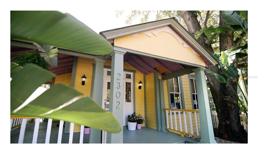 The Hemingway is the perfect blend of historic charm and modern convenience with this breathtaking craftsman-style home. Built in 1902, this 3-bed, 2-bath bungalow boasts over 2,015 sqft of living space, complete with high ceilings, hardwood floors, and designer touches throughout. You'll immediately fall in love with the open-concept living and dining area, perfect for entertaining or family gatherings. The kitchen boasts stainless steel appliances and ample cabinet space, while still maintaining the original character of the home. The extra-large master bedroom offers plenty of space for a king-size bed, and the en-suite bathroom is bright and spacious. Relax and unwind on the spacious wrap-around porch, the perfect spot for morning coffee or evening cocktails. The fully-fenced yard offers a safe haven for pets and family with newly added turf yard space. The neighborhood is filled with vintage homes and is situated between two of the city's most popular neighborhoods, giving you the best of both worlds. With its prime location, you'll be just minutes away from the best dining, shopping, and entertainment in Tampa. This historic gem is located just a few blocks away from popular locales such as Riverwalk, Armature Works, & Downtown, making it the ideal location for those who want to immerse themselves in Tampa.