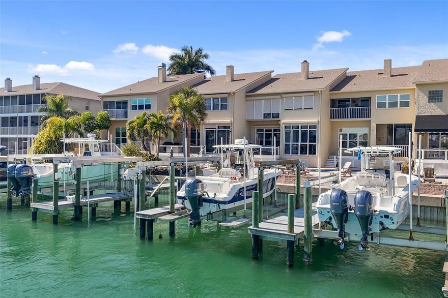 Unit 106 /6: Live the ultimate Tierra Verde boating lifestyle with spacious waterfront living, a 16,000-lb boat lift. The slip is 40ft long. You have fast, protected access to the open waters of Tampa Bay and the Gulf. If you’ve been waiting for a home that offers room to spread out plus a flexible in-law suite or private office/studio, this is it.
This beautifully updated 3,300 sq ft waterfront townhome lives like a single-family home, tucked within a small, exclusive community on the pristine island of Tierra Verde. Featuring 4 bedrooms, 4 full bathrooms, and 1 half bath, it provides generous space for everyone.
Pass through the lush, fenced courtyard and double doors into a grand foyer that introduces one of the home’s most striking features — a temperature-controlled walk-in wine cellar for up to 500 bottles. The chef’s kitchen impresses with wood cabinetry, central island, stainless steel upscale appliances, three ovens, new refrigerator, beverage fridge, ice maker, and a dedicated coffee counter. A side bar enhances the space for entertaining, all framed by serene saltwater canal views.
The kitchen opens to the breakfast bar and the expansive living/dining areas, perfect for gatherings. The contemporary fireplace wall leads to the waterfront patio — ideal for grilling, lounging, and watching dolphins and manatees swim by. The community’s waterside pool is only steps away.
Upstairs, the primary suite is a true sanctuary with high ceilings, private balcony, and breathtaking views. The spa-inspired en-suite features a freestanding tub, dual vanities, walk-in shower, and a spacious closet. Two additional guest suites are thoughtfully positioned across the hall. A same-floor laundry and bonus flex area just few steps away (office, gym, or extra storage) add convenience.
Below, the street-level 2-car garage sits beneath a large mother-in-law suite with kitchenette, living area, walk-in closet, and full bath — perfect for guests, extended family, or a private workspace.
For peace of mind, hurricane shutters protect the waterside windows, and no flood damage occurred during the 2024 storms. Major updates include a new composite deck (2022) — the largest in the community — newer roof (2021), dock (2019), new motors/gears/cables (2021), updated HVACs (2018/2019), new water heater (2024), upgraded tankless water heater and subpanel, and a 2023 wine cellar installation.
Located in a pet-friendly waterfront community that allows two pets, with a pool, walking/biking trail, and quick access to downtown St. Petersburg, Fort De Soto, and Pass-a-Grille Beach, this home offers the perfect blend of privacy, convenience, and pure island living.