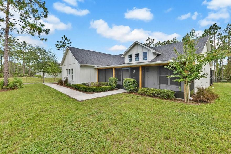 ** FARM HOUSE ALERT**Welcome to 9054 Lincoln Rd. St. Cloud Fl. Country living at it's finest! This gorgeous CUSTOM BUILT 2022 home sits on almost 1 FENCED IN acre. With BRAND NEW WORKSHOP, SCREENED FRONT PORCH AND EXTENDED LARGE SCREENED IN LANAI in back yard, TOP OF THE LINE NEW WATER PURIFYING SYSTEM AND MATCHING CUSTOM BUILT CHICKEN COOP. This home is a MUST SEE! Upon approching the home you will notice the ceadar wrapped colloms, the great double door entry. LUXURY VINYL FLOORS TRHOUGH OUT THE HOUSE! Relax in front of the FIRE PLACE featuring a hand crafted Cypress mantle or enjoy making Family diners in the OVERSIZED kitchen. Kitchen featuring Island with quarts counter tops, custom made hood vent, farm house sink, soft closed solid wood doors and drawers. MASTER SUITE is STUNNING, 2 WALK IN CLOSETS WITH hard wood shelving, SLIDING BARN DOORS, GARDEN TUB, WALK IN-SHOWER, HIS AND HERS VANITIES WITH QUARTZ COUNTER TOPS. NO HOME OWNER ASSOCIATION! ALL FURNITURE COULD BE NEGOTIABLE.centrally located and top rated schools .MOTIVATED SELLERS! Schedule your showing today!