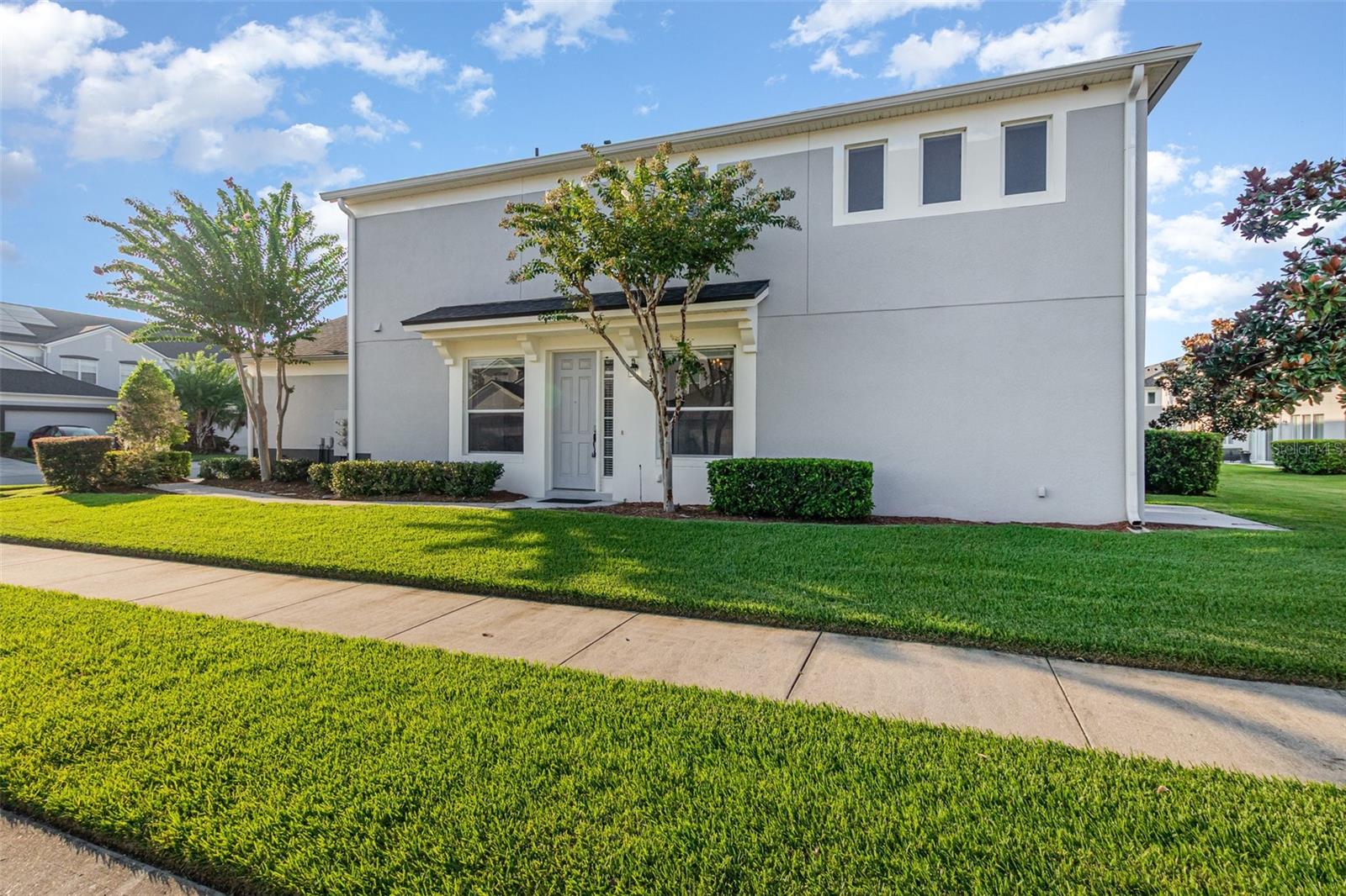 One or more photo(s) has been virtually staged. Look no further! Don't miss your opportunity to live in the highly desirable, 24-hour guard gated community of Spring Isle that has it all! Resort-style amenities with community pool, clubhouse, fitness center, playground and dog park. Step into your beautifully designed, end unit townhome featuring a functional floorplan. Enjoy the versatility of two spacious primary suites, both ensuite, one on the main level and one on the upper level. Another loft or flex-space upstairs with it's own bathroom makes it perfect for a home office, den, second living room or play area. High ceilings and rich colored flooring create a warm, inviting atmosphere. The kitchen is equipped with sleek stainless steel appliances and offers a functional layout with its own defined space, separate from the main living and dining areas. Also on the main level is a half bath—perfect for accommodating guests. Thoughtfully appointed and move-in ready, this home offers a balance of privacy, style, and everyday comfort. And the location can't be beat. Easy access to downtown Orlando, close to freeways and college campuses, this one has it all. Schedule your showing today!