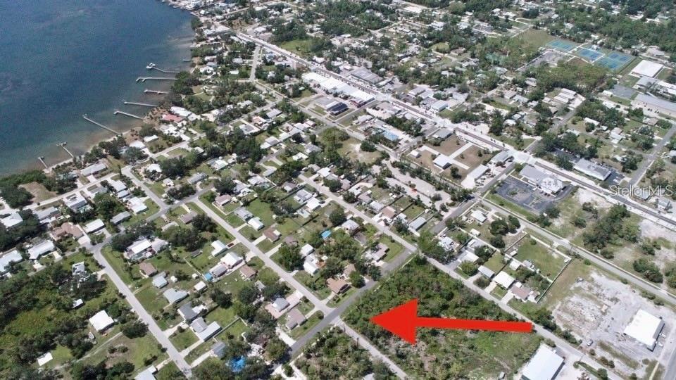 Walk to Historic Old Englewood Village from this corner lot. City water, sewer and high speed internet available. This undeveloped lot is located smack in the middle of Old Englewood just blocks from shopping, dining, car shows and the areas largest farmers market. Walk to Lemon Bay for sunsets then diner and dancing on the way home. Splash the boat at Indian Mound Park boat ramp at the end of the street then park it back in your yard, there are no deed restrictions or HOA dues here. If you always wanted to live in a charming waterfront village with great elevation, (Flood Zone X500), and tons of amenities within a quarter mile, this is your lot!