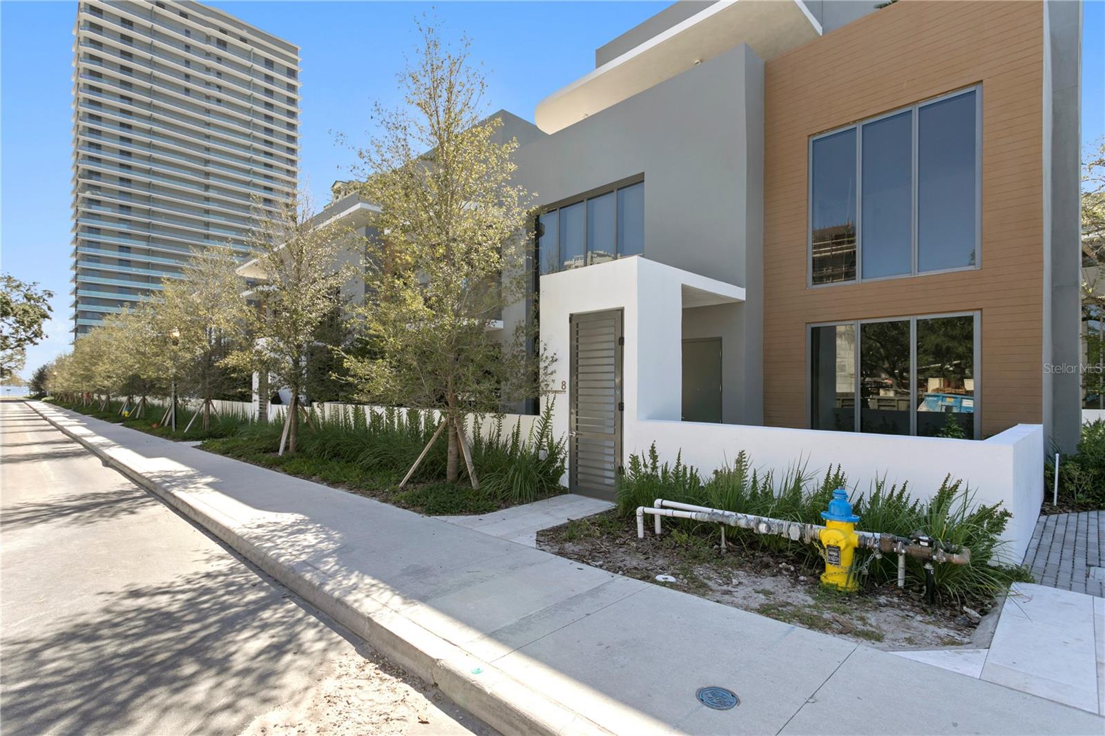 Now is your chance to own one of the ten exclusive *Ritz Residences Villas* located right off of Tampa’s scenic Bayshore Boulevard. Here the ultimate luxury lifestyle exists with world class amenities -making it feel as if you live in a 5 star hotel- including valet parking service, a doorman and Concierge with an Onsite Manager, a restaurant with seasonal menu changes and an expansive resort-style pool deck with private cabanas and full-service food and beverage options. The shared outdoor space offers 12,000 SqFt. of resort-style amenities including lounge areas, a regulation-sized tennis court, state-of-the-art gym and fitness studio with yoga rooms, media lounge, owners-only wine room for tastings and storage, separate men’s and women’s steam room and saunas with on-demand spa services. The three bedroom, four and half bathroom PLUS den/ Media room villa is ready for IMMEDIATE move in! A rare END UNIT that lives like a single family home with the most beautiful streetscape area and lush greenery with wide sidewalks that give you access to all The Ritz has to offer. Indoors, an abundance of light from all directions with soaring ceilings and the most beautiful finishes which all has been upgraded, with plenty of room for entertaining. The Chefs kitchen includes the most sensational custom “Ritz Blue Cabinetry" by ItalKraft, all paneled appliances- Sub Zero and Wolf, and complemented by bespoke Stone counter tops. Other highlights of this residence include an outdoor kitchen, multiple terraces, and a rooftop spa. Completed with a double height great room, spacious walk-in closets, high-end Kohler plumbing fixtures, and full-size top-of-the-line washers and dryers and an in-unit elevator. The residence also comes with two designated parking spaces, one space in the garage and one space directly in front of the unit for convenience. Walking distance to some of the best restaurants in all of South Tampa! Close proximity to Downtown Tampa, Hyde Park Village, Tampa Airport! This unit is #8 of 10 Luxury Townhomes. A+ Rated Schools, Roosevelt, Coleman and Plant.