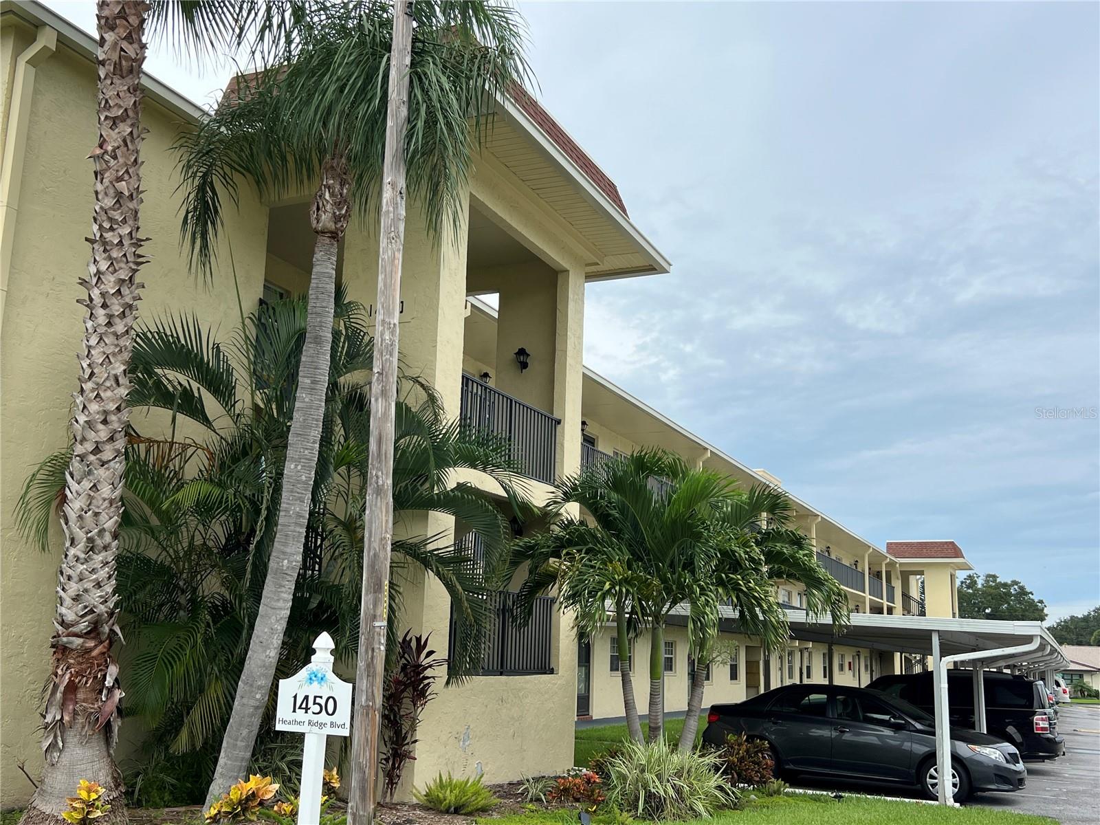 Nicely maintained 2 Bedroom, 1 Bath condo In the Heather Ridge 55+ community. located in an X flood zone in a fully funded condo association that has made substantial improvements since 2015 such as roof, balconies, walkways, elevator modernization. All Milestone and Structural inspections have been completed and no assessments nor monthly maintenance fees in 2026 are anticipated. The condo has an eat-in Kitchen, split bedroom plan, elevator access, community pool nearby. The outdoor balcony overlooks a serene and beautiful community lake and quiet greenery. The Dunedin location offers everything you could look for in a Florida getaway. Enjoy nearby causeway beaches and infamous Honeymoon and Caladesi Islands State Parks, golf, marina, Fine Art center, Community Center, Hale Activity Center, Toronto Blue Jays baseball stadium, restaurants, breweries, festivals with an easy commute to Tampa, International Airport and cruise Lines and the Tampa arts, entertainment and sports teams and venues. Condo can be purchased mostly furnished including a space saving Murphy Bed. Condo fee includes building exterior maintenance and insurance, water, sewer, trash, cable, internet, No Pets, one car. Come live the true Florida lifestyle.