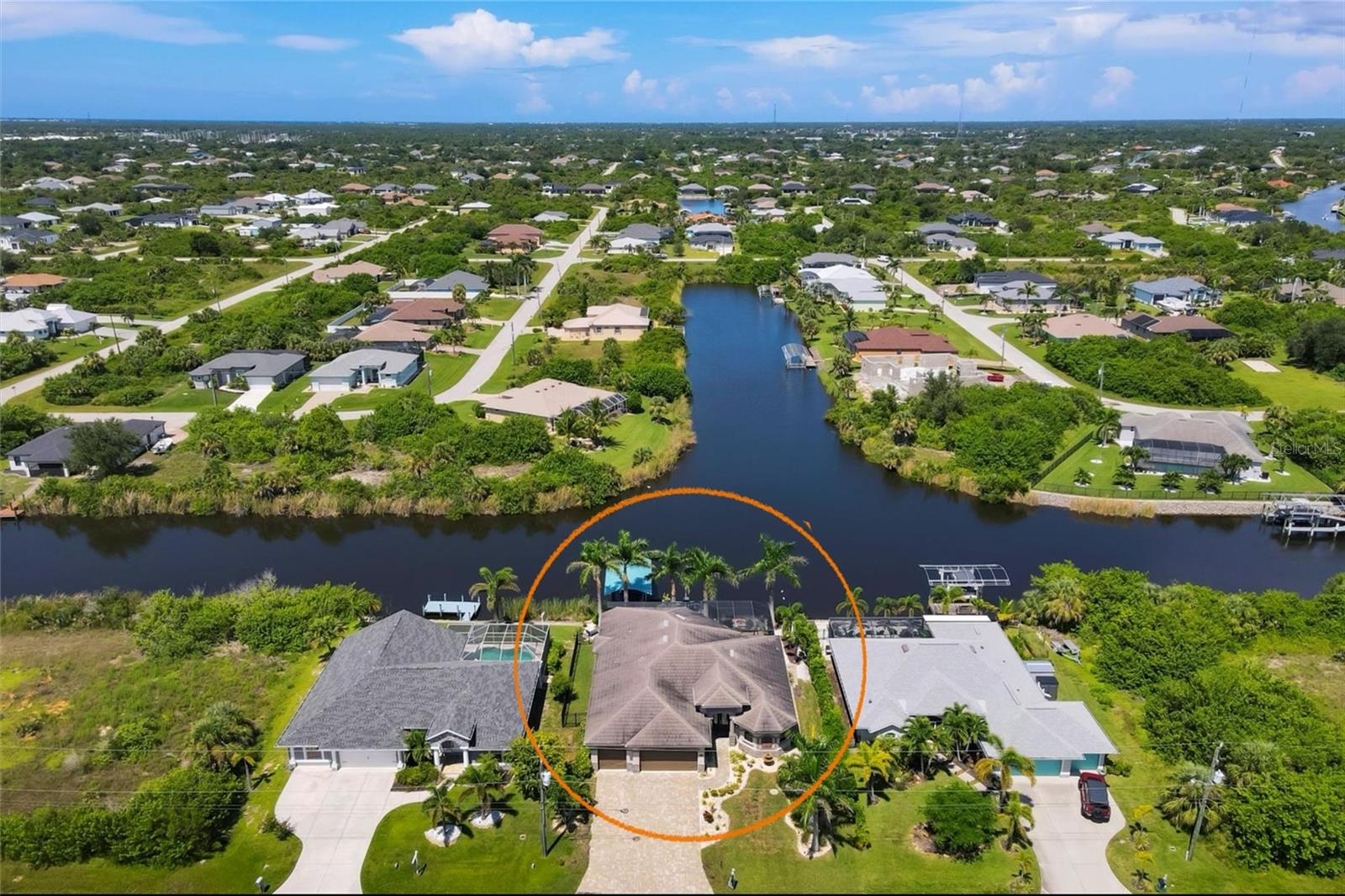Don’t miss this incredible opportunity to own a piece of Florida paradise. Located in beautiful South Gulf Cove, this home has everything you are looking for. Offered turn-key furnished for an additional $25,000, its move in ready so you can start enjoying paradise right away. As you step through the elegant entryway, you’re greeted by an open floor plan that seamlessly blends the living room, dining area, and a beautifully appointed gourmet kitchen. The living area features expansive zero-degree sliding doors that open completely, allowing you to step effortlessly onto the lanai and embrace indoor-outdoor living at its finest.
To your left, the chef’s kitchen is a delight, with sleek finishes and a view connecting you to the dining space, perfect for entertaining. On the right, the primary suite offers privacy and luxury, including a spectacular walk-in shower that you can enter from either side, creating a spa-like retreat. The Primary bedroom also overlooks the pool and water, giving you a peaceful view to wake up to.
Throughout the home, elegant tray ceilings add a touch of grandeur and spaciousness. A convenient indoor laundry room is located off the garage. Outside, the heated saltwater pool invites you to relax or entertain with endless sunsets by the pool. Host gatherings with ease in the outdoor kitchen, complete with a Bullet grill, wine fridge, range hood, and TV—perfect for catching the sunset.
The property features a 10,000-pound boat lift with water and electricity at the dock, along with a brand-new Waterway boat cover installed in 2025. Unwind by the fire pit as you take in serene water views.
With impact windows and thoughtful upgrades throughout, this home is a true gem. Located just minutes from Boca Grande for world-class fishing, local dining, and shopping. Explore the natural beauty of the area by paddle board or kayak, and embrace the ultimate Florida lifestyle today! Don’t let this chance slip away— call to schedule your private showing today!