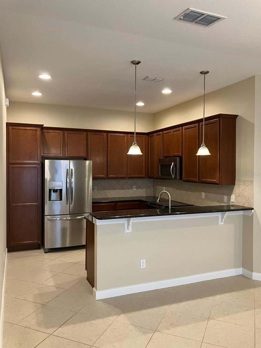 Photo of 11896 Fiore Drive, Orlando, FL 32827 (MLS # O6430383)