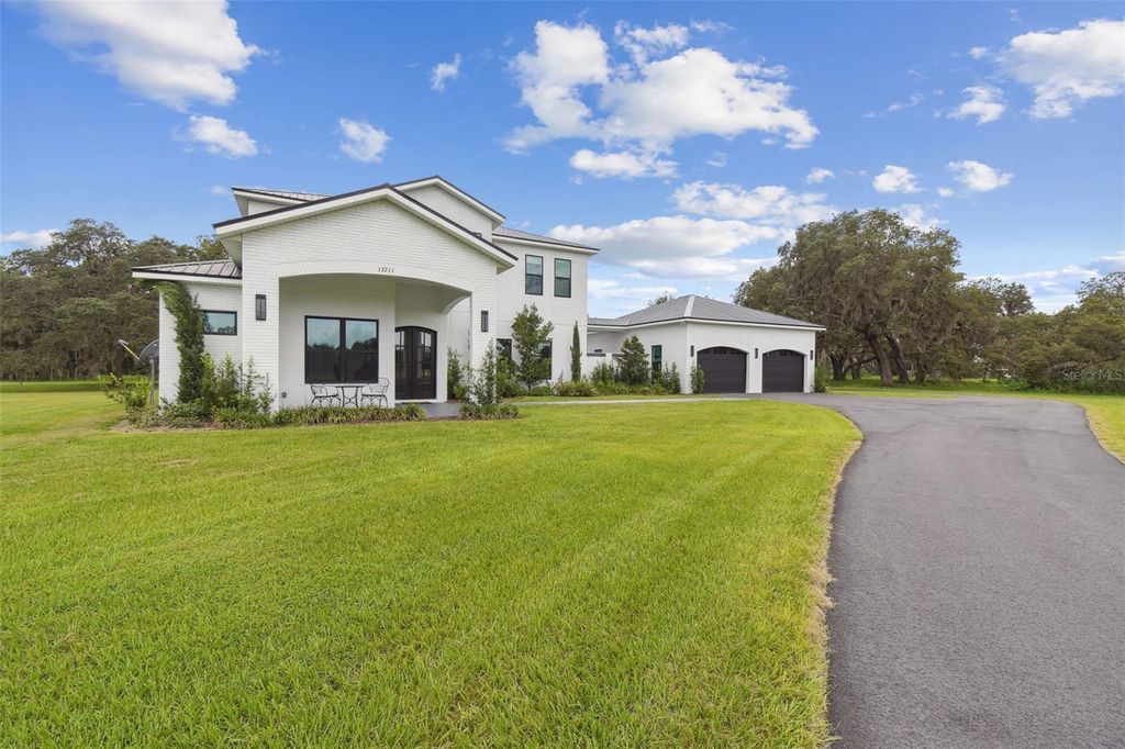 Photo of 13711 Lussier Lane, Spring Hill, FL 34610 (MLS # TB8407991)