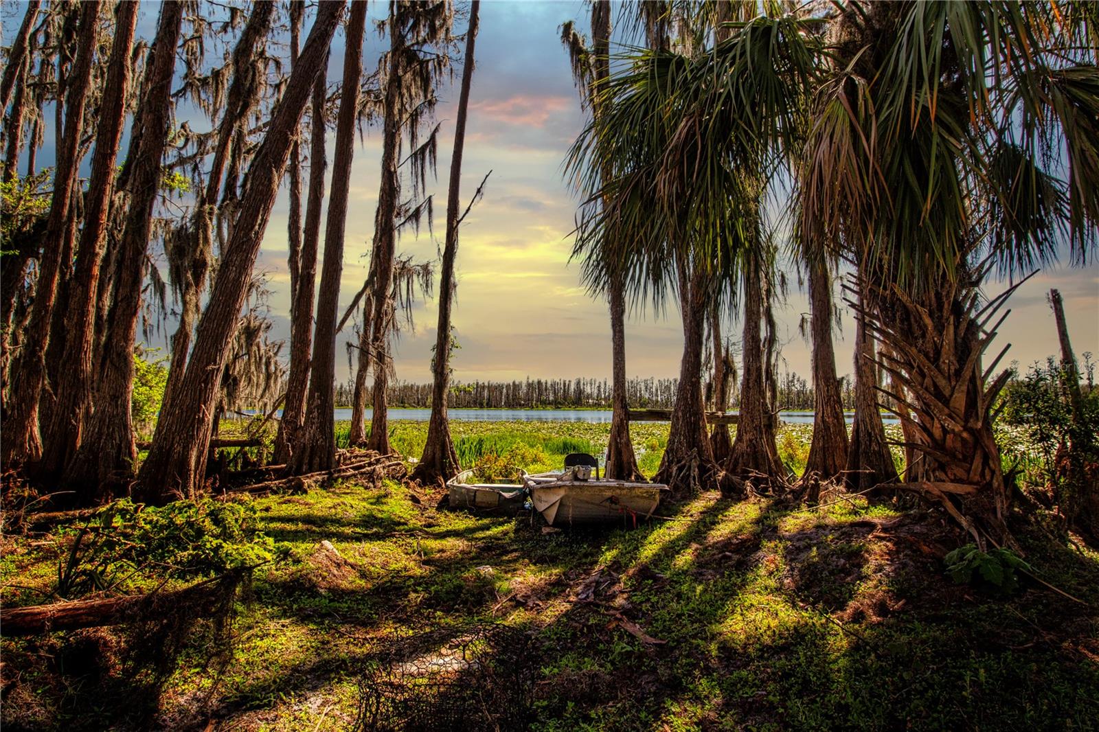 This lot features 27 glorious acres of cleared vacant land ready for development that has over 600 Feet of cypress lined lake front. With 875 feet of road frontage the opportunities are endless. County approves that AR zoned lot can split for up to five 5 Acre lots for commune style living or induvial home sites Enjoy fishing, canoeing, 4 wheeling and campfires. Only 10 Miles From I-75 grocery stores, banks, schools and restaurants. Dont miss this rare opportunity! Call for a private tour!