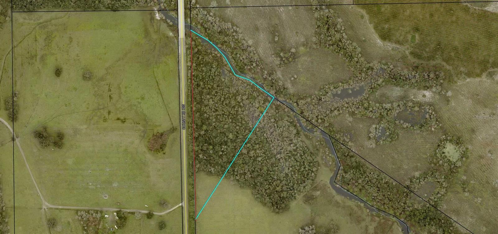 10.73 acres of Magnificent Haw Creek frontage acreage on County Road 305. Fantastic outdoor enthusiast site, with Haw Creek feeding Crescent Lake, renowned for largemouth bass fishing. Nearby Haw Creek Preserve offers a boat ramp and a dog friendly park with trails, boardwalks, BBQ picnic areas and public restrooms just 2 miles away. This property is partially cleared and ready to build on. The northern part of the property has majestic oak trees. This property is 13 miles from US Hwy 1 in Bunnell, 18 miles from I-95 and 21.7 miles to the ocean, driving distance. Road frontage on CR 305 is 1450 feet. Haw Creek frontage is 125+ feet.