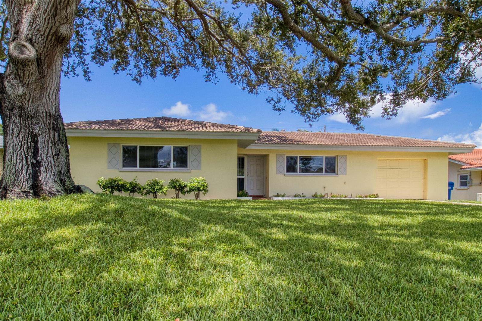 Remodeled block home just minutes from Indian Rocks Beach in the sought-after Grove Lake Manor neighborhood. Sitting on nearly ¼ acre, this 2 bed, 2 bath home offers a bright, open layout with engineered hardwood floors and updated tile in the kitchen. Features include double-pane windows, hurricane shutters, and a 2019 A/C + 2023 water heater. NO damage during storms last year, NO flood insurance required.
The updated kitchen boasts granite counters, stainless appliances, soft-close cabinets, and a reverse osmosis system. The family room brings in natural light with large windows and sliders leading to a screened lanai. The fenced backyard includes a shed, and room for a pool. Both bedrooms are spacious with ample storage. Close to beaches, shopping, dining, and hospitals.