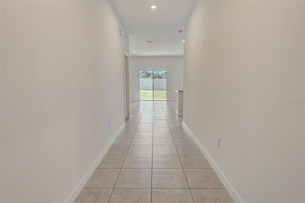 Photo of 957 Pearlwood Loop, Eagle Lake, FL 33839 (MLS # O6405953)