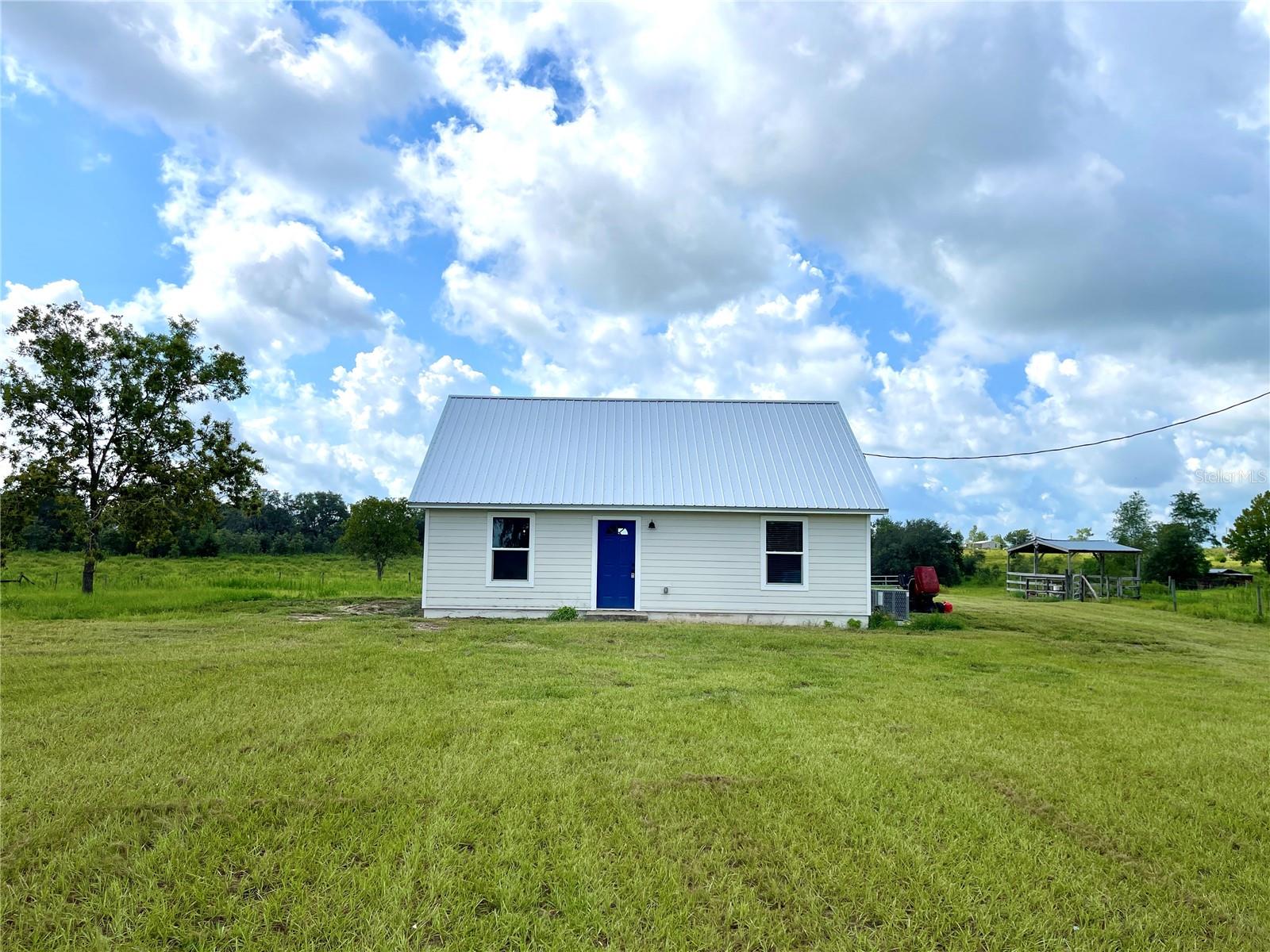 This quaint home is nestled in the spacious Green Hills neighborhood in Bronson. Enjoy beautiful views of rolling hills from the bedroom and kitchen windows, an acre of land which is maintained by the homeowner, and a fenced and gated yard. The bathroom has been updated, and kitchen has all new appliances. 9 extra acres can be included in the lease for an additional price.