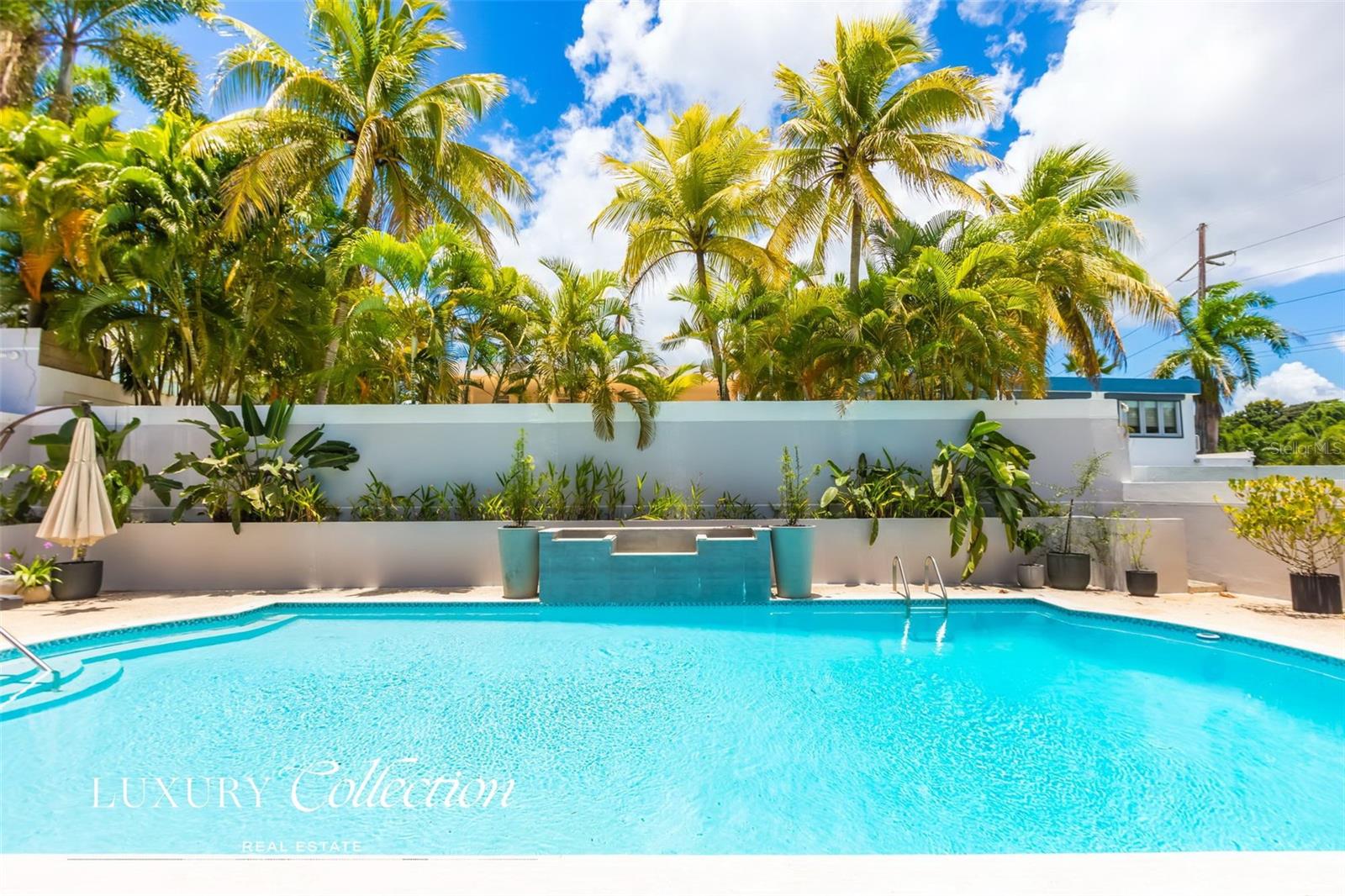 For Sale – Stunning Paseo San Juan House, Puerto Rico
Discover this beautifully remodeled residence offering 5,095 sq. ft. of gross living area on a spacious 945 sq. meter lot. Designed with comfort and functionality in mind, the home features 4 bedrooms (convertible to 5) and 3.5 bathrooms, all enhanced by high ceilings and abundant natural light throughout.
Modern upgrades include a full power generator, solar panels with battery backup, and a water cistern, ensuring seamless living during power outages.
Step outside to a covered terrace with a built-in bar, perfect for entertaining. The terrace leads to a private backyard oasis with a large swimming pool, creating a serene space for outdoor enjoyment.
A rare opportunity to own a turnkey home in one of San Juan’s most desirable gated communities.
Contact us today for a private showing.