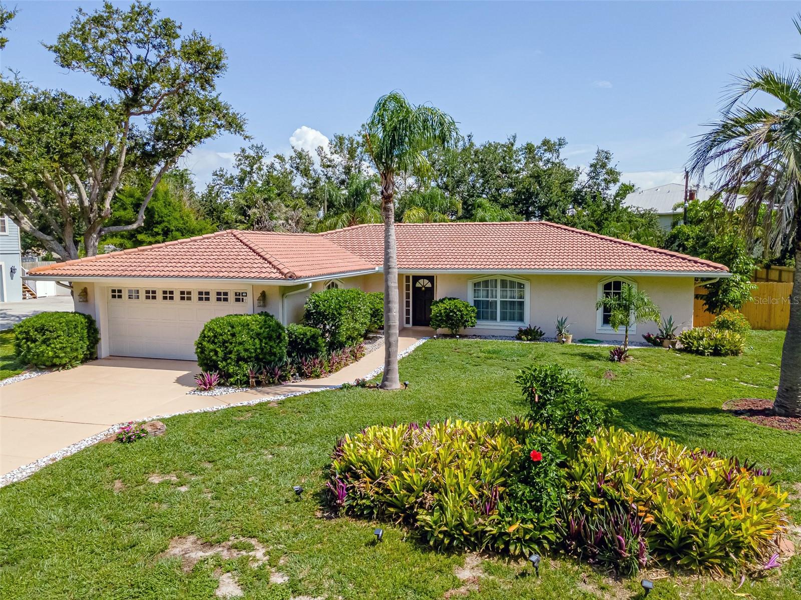 Discover this hidden gem in the sought-after waterfront community in Bay Acres, positioned West of the Trail with direct access to the Intracoastal Waterway situated on .037 acres that is completely fenced in for privacy! This beautifully renovated home has 3 spacious bedrooms and 2 bathrooms across 1,904 sqft, offering a split bedroom floor plan for maximum privacy. The primary suite features double walk-in closets and a luxurious en suite bathroom with his and her sinks and a walk in shower. Enjoy the Florida lifestyle on the large, oversized screened-in lanai or entertain guests easily with double doors that create a seamless indoor/outdoor flow. The property is completely fenced in and includes a 10 x 36 concrete pad, perfect for your RV, boat, or conversion to a shuffleboard or bocce court. The home offers convenient boat access via the community dock, and an optional HOA for just $75 annually. Additional highlights include a central vacuum system, built-in shelving and storage in the garage, an electric car charger, newer appliances, alarm and irrigation systems, a freshly painted walkway and lanai, and a dedicated dining space. Located in the desirable Pine View School District, with quick access to Highway 41, beaches, shopping, and restaurants in Nokomis, Venice, and Siesta Key. Don’t miss your chance to own this exceptional home with direct access to the intracoastal waterway. Call to schedule your appointment today.