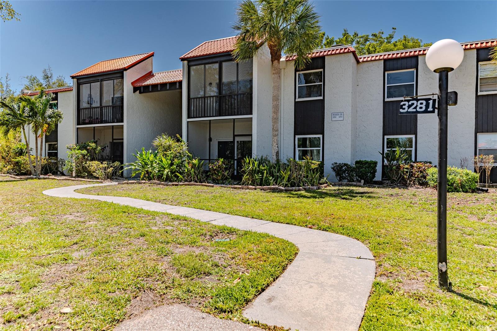 Welcome to your beautifully updated 2-bedroom, 2-bathroom condo, offering the perfect blend of modern finishes and Florida resort-style living! Step inside to find fresh tile flooring in the kitchen and baths, luxury laminate wood floors, and brand-new carpet and pad in the bedrooms. The kitchen is a showstopper, featuring crisp shaker cabinets, solid stone countertops, a sleek subway tile backsplash, and new matching stainless steel appliances. Both bathrooms have been thoughtfully updated with new vanities and modern finishes. The spacious master suite includes a private bath and a large walk-in closet for added convenience. Enjoy relaxing mornings and breezy evenings on your oversized balcony with views of the tennis courts and lush green space. Community amenities include a sparkling pool, tennis courts, and shuffleboard courts, perfect for embracing the Florida lifestyle year-round. Additional highlights include a brand-new water heater, ceiling fans,stylish new fixtures throughout, and more — making this home move-in ready and ideal for your next chapter in the Sunshine State!