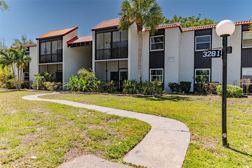 Welcome to your beautifully updated 2-bedroom, 2-bathroom condo, offering the perfect blend of modern finishes and Florida resort-style living! Step inside to find fresh tile flooring in the kitchen and baths, luxury laminate wood floors, and brand-new carpet and pad in the bedrooms.  The kitchen is a showstopper, featuring crisp shaker cabinets, solid stone countertops, a sleek subway tile backsplash, and new matching stainless steel appliances. Both bathrooms have been thoughtfully updated with new vanities and modern finishes. The spacious master suite includes a private bath and a large walk-in closet for added convenience. Enjoy relaxing mornings and breezy evenings on your oversized balcony with views of the tennis courts and lush green space. Community amenities include a sparkling pool, tennis courts, and shuffleboard courts, perfect for embracing the Florida lifestyle year-round. Additional highlights include a brand-new water heater, ceiling fans,stylish new fixtures throughout, and more — making this home move-in ready and ideal for your next chapter in the Sunshine State!