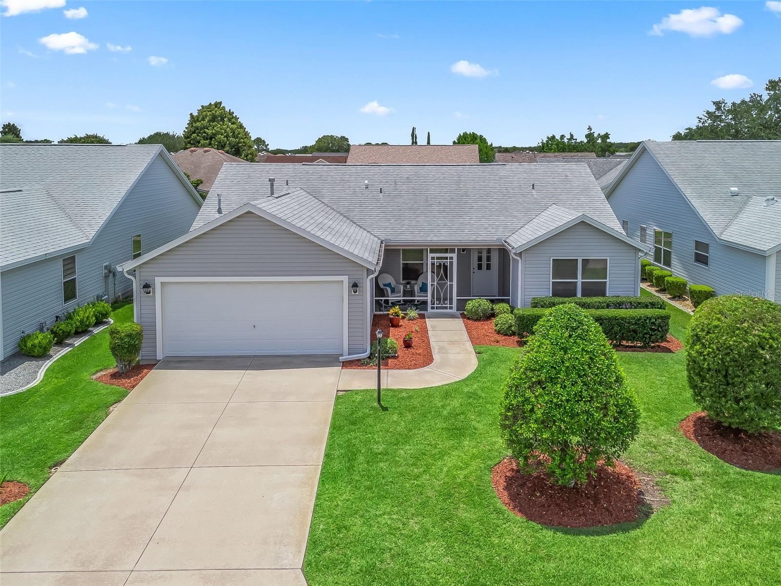AFFORDABLE BANYAN MODEL w/ FLORIDA ROOM & GREAT LOCATION—BOND PAID!
Welcome to this charming 3-bd, 2-ba, 1527 sq ft Banyan model in the The Villages, FL! Lovingly used as a seasonal retreat for 22 years, this home offers a thoughtful design and endless potential—all at a price that lets you make it your own!
Enjoy TWO screened OUTDOOR SPACES: a front porch and a rear lanai for morning coffee or evening relaxation. Inside the double-peak VAULTED CEILING ehances the living room, plus a SPLIT BEDROOM LAYOUT provides privacy for guests, with a POCKET DOOR to separate their wing from the main living area. Covenient INSIDE LAUNDRY room, plus The NATURALLY BRIGHT Florida Room adds extra square footage for hobbies, entertaining, or simply stretching out.
ROOF (2020) and a Brand NEW HOT WATER HEATER offer peace of mind and its Move in ready, mostly TURNKEY! While in GREAT CONDITION the price considers the original carpet, linoleum, laminate counters, and white appliances, and leaves room for your personal upgrades;renovate and create your dream home!
LOCATION, LOCATION, LOCATION!
Nestled between Nancy Lopez & Glenview Country Clubs (just 1.3 miles in either direction!), and close to both Spanish Springs and Lake Sumter Landing, you're never far from golf, dining, shopping, and nightly live entertainment!
Surrounded by mature landscaping and minutes from:
Mulberry & First Responders Rec Centers
Savannah Center
Adult neighborhood pool (0.5 miles!)
Mulberry Grove Plaza: Publix, Bealls, Beef 'O' Brady’s, Sammy Joe’s & more!
Don't miss this rare opportunity to grab a well-maintained home in a prime location—with BOND PAID and priced for value!
Schedule your private showing today—your perfect Villages lifestyle awaits!