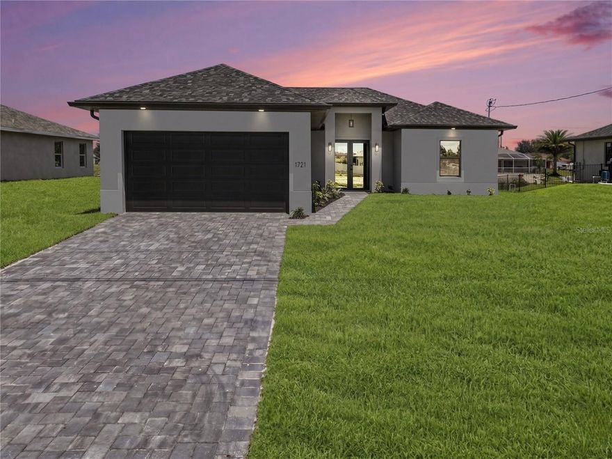 Check out this brand new construction, move-in ready gem! This beautifully designed 3-bedroom plus den, 2-bath home sits right on a freshwater canal, offering peaceful water views from the screened-in lanai. The sleek modern kitchen is a standout feature, complete with a stunning quartz waterfall island and stainless steel appliances. The open floor plan flows seamlessly, showcasing tile flooring throughout and tray ceilings in both the living area and master bedroom that add a touch of elegance. Safety and peace of mind come standard with impact-resistant doors and windows. Plus, you’ll love the convenient location close to schools, restaurants, and shopping centers. It’s everything you want in a home, all wrapped up in one stylish package!