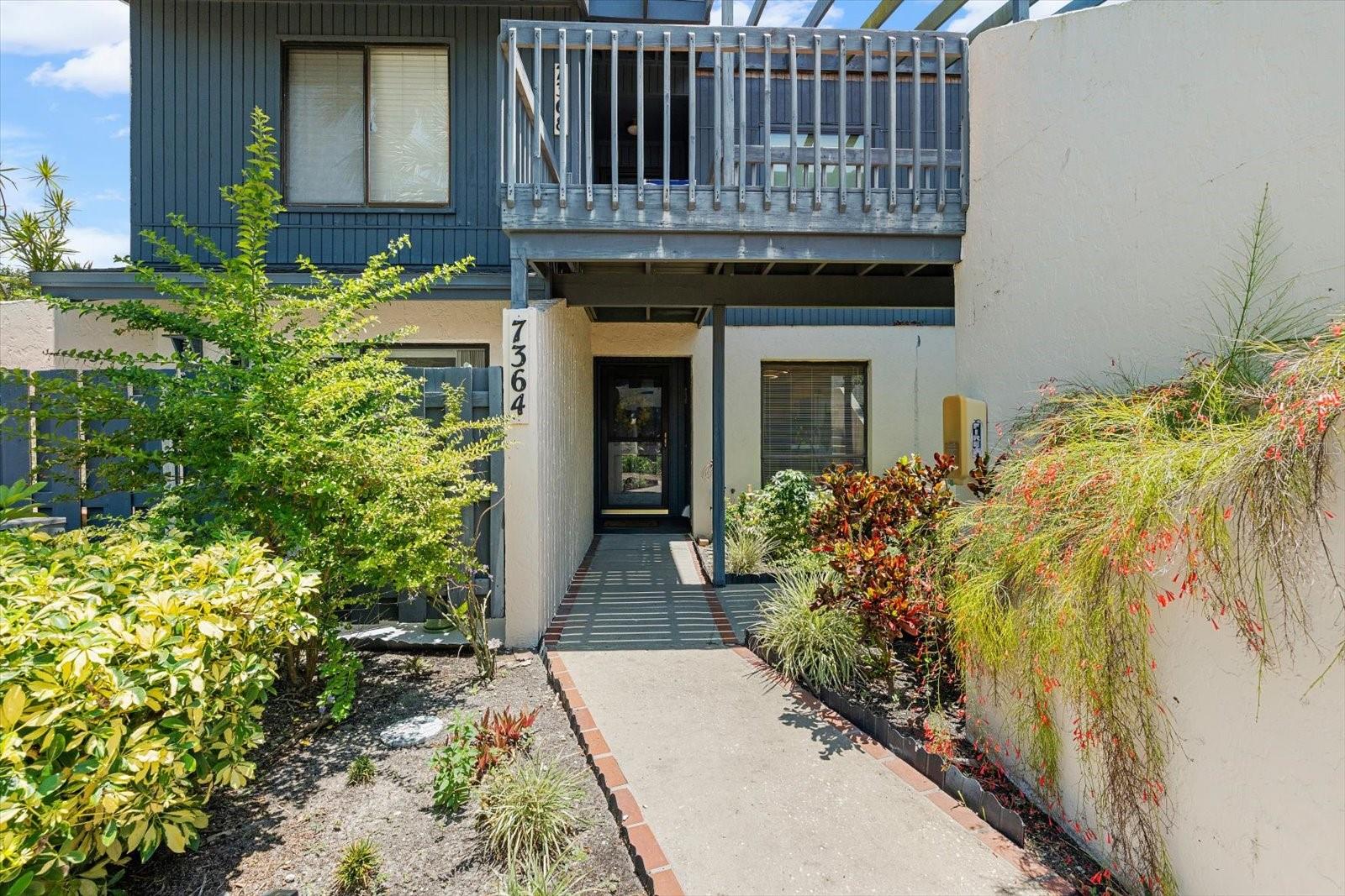 Welcome to effortless Florida living in this beautifully updated end unit condo located in the desirable Gulf Gate area, just minutes from downtown Sarasota and the world-renowned Siesta Key Beach! This charming home offers a blend of character and modern comfort, beginning with a covered entry, front storm door, and original brick foyer that adds timeless charm the moment you step inside. Enjoy peace of mind with a new roof, new lighting throughout, new flooring, a brand-new dishwasher, and newer HVAC and hot water heater. The kitchen features lots of storage, a quaint dining nook, and a serving window that opens to the formal dining area. The open-concept family room flows seamlessly and offers abundant natural light through a double sliding glass door that opens to your spacious covered patio, perfect for relaxing or entertaining. The split bedroom floor plan is ideal for roommates or guests, providing optimal privacy and functionality. The primary suite is tucked away at the back of the home, offering a peaceful retreat with updated tiled walk-in shower, spacious vanity, and private access to the back patio. The second bedroom, located at the front, also has its own private patio, with a full bathroom conveniently located nearby. Both patio areas are fenced for privacy and maintained by the community, along with all yard maintenance, making this truly low-maintenance living. Enjoy a wealth of community amenities including a pool, clubhouse, meeting room, tennis, pickleball, and more. Plus, you're conveniently located near historical and cultural landmarks like Venice, UTC (University Town Center), Gulf Gate Library, Sarasota Square, and so much more. With endless shopping, dining, and entertainment options available year-round, this location offers the best of Sarasota’s vibrant coastal lifestyle. Whether you're looking for a full-time home or a seasonal escape, this condo has everything you need—and more.