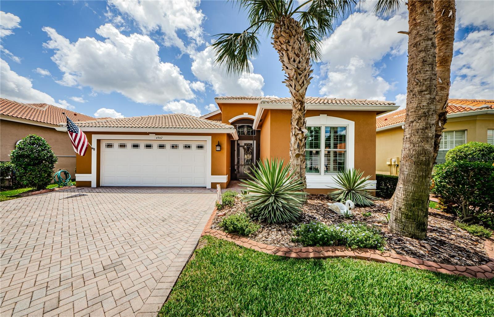 Welcome to 4947 Sandy Brook Circle - an elegant and exceptional Genova floorplan built by GL Homes in 2008 in the highly desirable Valencia Lakes 55+ resort-style community. This stunning 2 bedroom, 2 bath home with a dedicated office will capture your eye from the moment you arrive, you'll be impressed by the beautiful curb appeal, welcoming foyer where you will see the true reflection of diligent care and attention this home has received over the years. Inside, enjoy a thoughtfully designed open floor plan with upgraded finishes, including crown molding and tray ceilings throughout. The spacious living areas are filled with natural light, creating a warm and inviting atmosphere that is perfect for both everyday living and entertaining. The kitchen blends nicely with the formal dining and great room to ensure a welcoming floorplan. With plenty of counter, cabinet and pantry space the kitchen is definitely a chef favorite! The primary bedroom is serene with a lovely view overlooking the lanai and sparkling pond. The primary bathroom has his and hers vanities, garden tub, zero entry shower and walk in closet. Step outside to your lavish, oversized screened in lanai, where tranquil water views provide the ideal backdrop for morning coffee or sunset dinners. This home has been maintained to top-notch specifications by a diligent and detailed homeowner, offering a true move in ready peace of mind. Valencia Lakes is renowned for its active lifestyle and resort amenities - including a clubhouse, pools, fitness, tennis, pickleball and countless social activities. Don't miss your opportunity to own this impeccably maintained, waterfront gem in on of Tampa Bay's most sought after 55+ communities! 2023 New HVAC 2023/2024 New Andersen Hurricane Sliders and 2 Great Room Windows