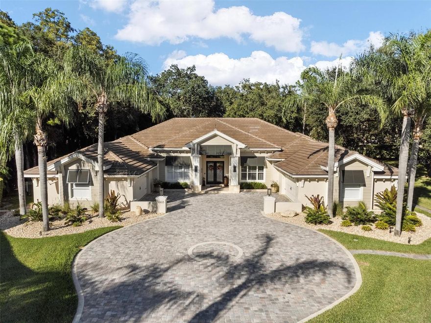 Don’t miss this magnificent Model Perfect property that has been updated to true custom builder standards. Architect-designed renovation with no expense spared. The seller has invested Hundreds of thousands of dollars in improvements starting with the exterior. New Tile Roof, Facia, Soffit, Lap Siding, New Stucco, New Exterior paint, and new brick pavers on the majestic driveway. Enjoy the privacy and solitude of this beautiful home nestled in the trees at the far end of the cul-de-sac. New large Fenced dog run, Exterior lighted to accent the new landscape package throughout the property. This 4 bedroom, 4 bath home with office and bonus room is a perfect combination of elegance and comfort. Entertain formally in living and dining rooms with a wall of sliders opening to the lanai and the expansive, private pool deck finished with new Travertine Decking surrounding the remodeled pool and spa package with new filter/Valve System, heater, LED Lighting & new Outdoor Kitchen/Bar with Block construction & Granite top. The pool cage was painted & re-screened. Large gourmet kitchen with New High-End Granite countertops, New High-End wood cabinets, stainless appliances, and a gas cooktop. 
 
The master bathroom is fully remodeled, walk-in marble shower, new stone tub, vessel sinks, High-End plumbing fixtures, Lighted Mirrors, new lighting fixtures, and new Tile floors. Relax in the soaking tub with a window atrium. The master bedroom features a sitting area and pool access.
 
Three additional bedrooms are in a split plan. Endless possibilities for the huge bonus room. Currently used as a game room, it could be a 5th bedroom, exercise, or theater room. Designer lighting, custom draperies, a wine bar, and second bar, all-new cabinetry, and a beautiful laundry room finish the look.

Four garage spaces in two separate garages, one air-conditioned, both with New Hurricane Rated Garage doors and Epoxy floors. 2 New 5-ton A/C Units with Smart Thermostats.
 
Location! Live on a quiet street in the exclusive gated subdivision of Muirfield in Eastlake Woodlands. Eastlake Woodlands is a golf and tennis community with two renowned golf courses and a newly renovated premier clubhouse. Membership is required to enjoy golf, tennis, swimming pools, a child activity center, and a gym. Eastlake Woodlands is central to all dining, shopping, and highly-rated schools. A short drive will take you to all area beaches, activities, and Tampa International Airport. For more pictures, be sure to watch the virtual tour with drone photography.