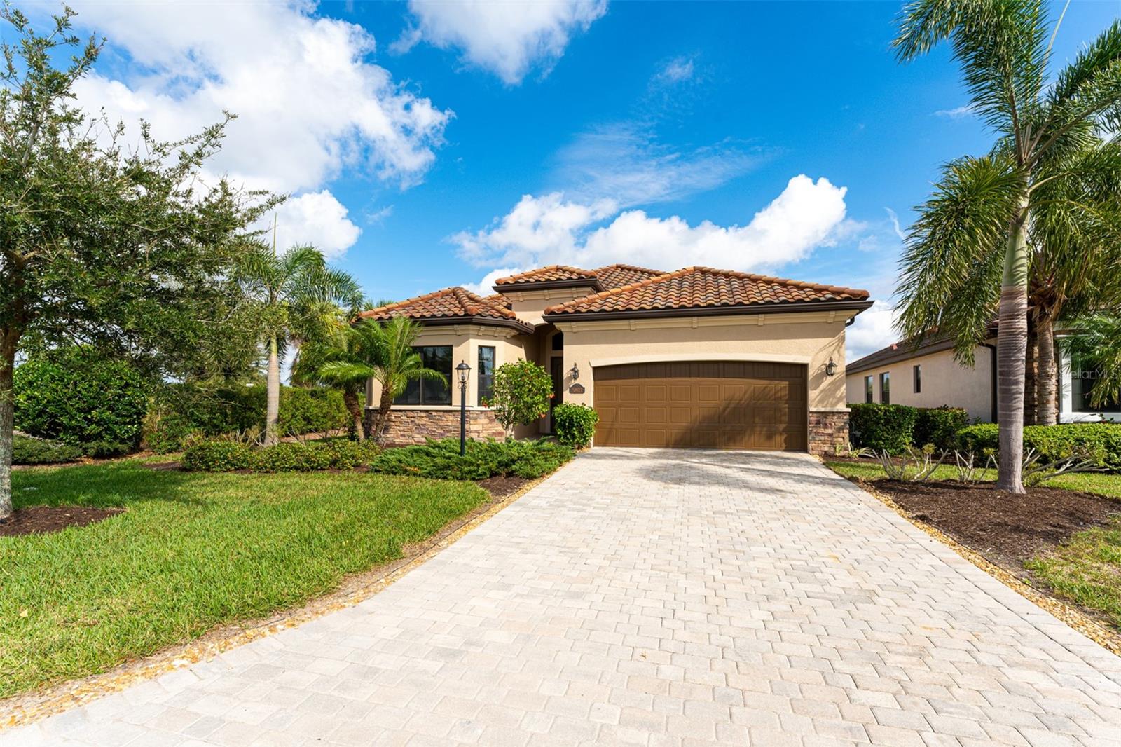 Welcome to Paradise! Be our guest and surround yourself in style and elegance in this former model home located in the Golf Community of Lakewood National. THIS ANNUAL RENTAL has everything you need to move right in and start living your best life! Annual renter wanted. The master suite offers a beautiful en-suite bath with double sinks, large walk-in shower and soaking tub with private access to the lanai. The second bedroom offers a queen bed with bath close by. The third is an office/bedroom with a large desk, custom built in shelving and a queen pull out sofa that can be used for additional guest quarters. This stunning home lends itself to fun and entertainment with an open floor plan and upgrades galore. Enjoy the magnificent view of the pond and the Arnold Palmer designed championship golf course as you relax and unwind in the tropical oasis from your own private heated pool and spa. Monthly rent includes pest control, pool and lawn care. Also features an outdoor kitchen with built in grill! Navigate the 36 hole Arnold Palmer designed unique and challenging GOLF COURSE. Amenities also include an on-site TIKI BAR/RESTAURANT, FITNESS CENTER, RESORT STYLE SWIMMING POOLS WITH OUTDOOR GRILLE AND POOLSIDE SERVICE, A FULL SERVICE SPA , TENNIS COURTS, PICKLE BALL AND MORE! Golf/Amenities Membership transfer is available. Conveniently located to the interstate, University Town Center Mall, Sarasota Airport and all that Lakewood Ranch has to offer including Lakewood Main Street with dining, shopping, miniature golf, movie theatre, monthly Music on Main Street, Cultural Arts in downtown Sarasota and St. Armand's Circle and our stunning gulf beaches.