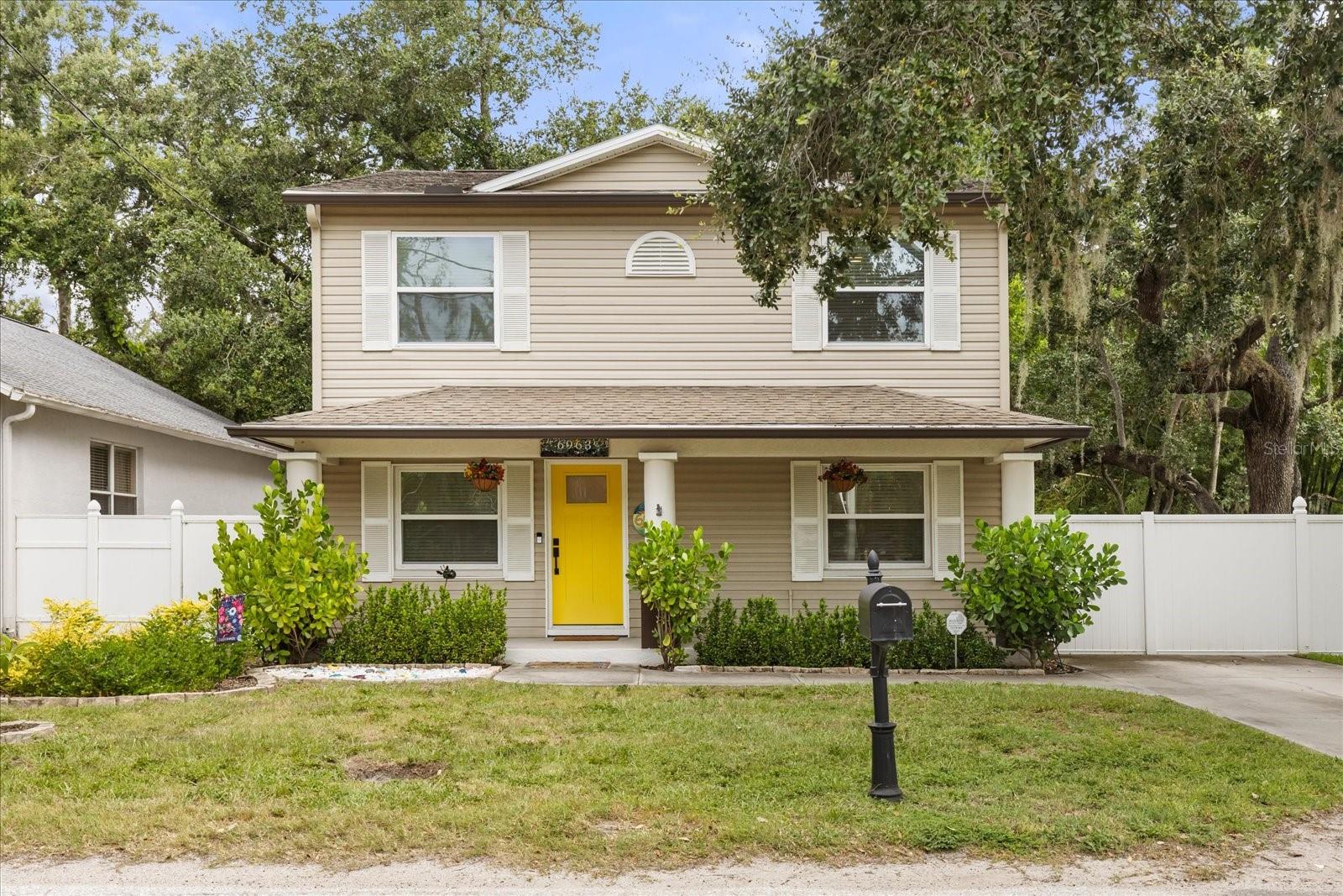 Welcome to 6963 South Manhattan Avenue – A stylish two-story retreat with heart and charm! Step into this thoughtfully designed 3-bedroom, 2.5-bathroom home boasting over 2,000 sq ft of inviting living space—where warmth, character, and comfort blend beautifully. This artist-styled home is full of unique personality and custom touches, including a one-of-a-kind surfboard chandelier in the dining room that adds a splash of Florida flair and creativity. As you enter, you’re greeted by a charming sitting area and a peek into the cozy yet spacious living room. Just to the left, a flex space currently used as a home office offers versatility to suit your lifestyle. Rich wood flooring runs throughout both levels of the home, adding warmth and continuity. The kitchen is both functional and stylish, with stone countertops, stainless steel appliances, and a clever serving window that opens into the dining room—doubling as a breakfast bar perfect for casual meals or morning coffee. Just around the corner, the conveniently located half bathroom adds ease to everyday living. Upstairs, you’ll find two well-appointed guest bedrooms, each with built-in closets, one featuring a charming accent wall. A full bathroom and a central laundry room lie between the bedrooms for easy access and practicality. Retreat to the spacious primary suite, where vaulted ceilings and triple windows invite in natural light and serenity. A generous walk-in closet with built-in shelving keeps things organized, while the en suite bathroom offers a dual-sink vanity and a stunning walk-in shower with modern floor-to-ceiling white tile. Step through the French doors onto the screened-in patio—your own private oasis. With ample room for lounging or entertaining, and adjustable shades for privacy or views, this space is perfect for any occasion. The patio also features a custom bar and a 7-person Caldera hot tub—both of which convey with the home—making it an ideal setup for relaxing evenings or social gatherings. Beyond the patio, a vibrant deck and a fully fenced backyard offer a playful touch and a blank canvas for gardening, entertaining, or simply relaxing under the Florida sky. From its unique touches to its functional layout, this home is full of heart—and ready to welcome you.