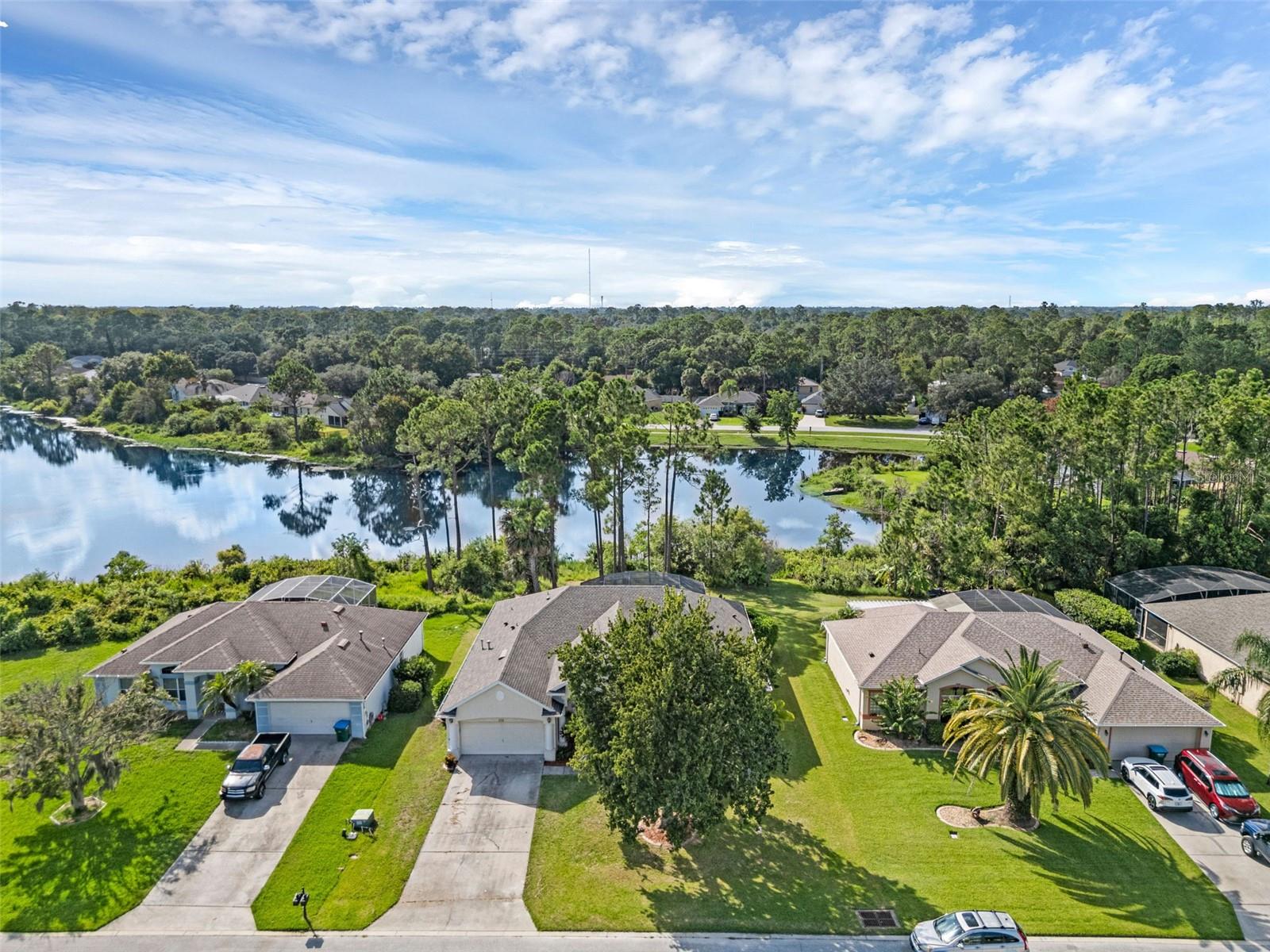 It’s the dream house:: Lakefront. Pool. Cul-de-sac. Oversized lot. All the major updates already completed. Featuring a new roof (2020), new HVAC system (2024), fully remodeled kitchen, and new flooring throughout (2021–2024), this beautifully updated 4-bedroom, 2.5-bath home offers peaceful waterfront living with stylish, move-in-ready… Legitimately this is your dream home!
From the moment you step inside, you’ll notice the soaring ceilings, architectural arched entryways, and a bright, open-concept layout that flows seamlessly from room to room. The remodeled kitchen is a true standout, boasting stunning quartzite countertops, stainless steel appliances, a tile backsplash, and an oversized island with a farmhouse sink—perfect for both entertaining and everyday living.
The thoughtfully designed split floor plan includes a spacious primary suite with room for a seating area or dressing space, plus a flexible secondary bedroom conveniently located near the half bath—ideal for long-term guests, a home office, or multi-generational needs. Fresh tile flooring graces the main living areas, while new plush carpet adds comfort in the bedrooms.
Outdoors, the magic continues. Relax by the screened-in pool, entertain under the covered lanai, and soak in the spectacular lake views. The oversized lot lines provide extra privacy, while the quiet cul-de-sac location offers a peaceful setting with minimal traffic—just minutes from local shops, dining, and commuter routes.
This home delivers the perfect combination of thoughtful updates, elegant design, and unbeatable lakefront living.
Schedule your private showing today—this is the one you’ve been waiting for.