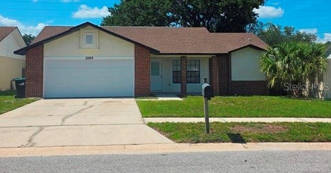 Photo of 10159 Chesham Drive, Orlando, FL 32817 (MLS # O6418394)