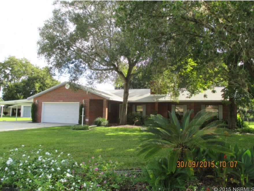 Country living at its best right in the city! Beautiful and carefully maintained red brick home (with frame construction behind the brick) on 1 acre of land. NEW ROOF COMING IN EARLY AUGUST 2016!!! Property has beautiful oak, pecan, lemon and Norfolk pine trees, Large fenced area for pets and 10'x12' utility shed on concrete slab. Kitchen cabinets have been refurbished & all appliances are new stainless steel. Both bathrooms have been remodeled and are handicap friendly, as is the home, in general. Hugh back patio/lanai with tiled floor and etched glass door leading from kitchen. Study/den has built in desk and cabinets and could serve as a 4th bedroom by adding an armoire. The oversized two car garage has lots of custom cabinets and storage space. In addition, there is a large 2 car covered carport with extended driveway and walkway to back of house. Security system is locally functional and can easily be connected to outside security plan if desired. Master bedroom features hardwood floors; foyer, study/den and kitchen are tiled, and remainder of home is carpeted. Carpeting was replaced throughout in 2013. A must see at a great price. ;Water: City