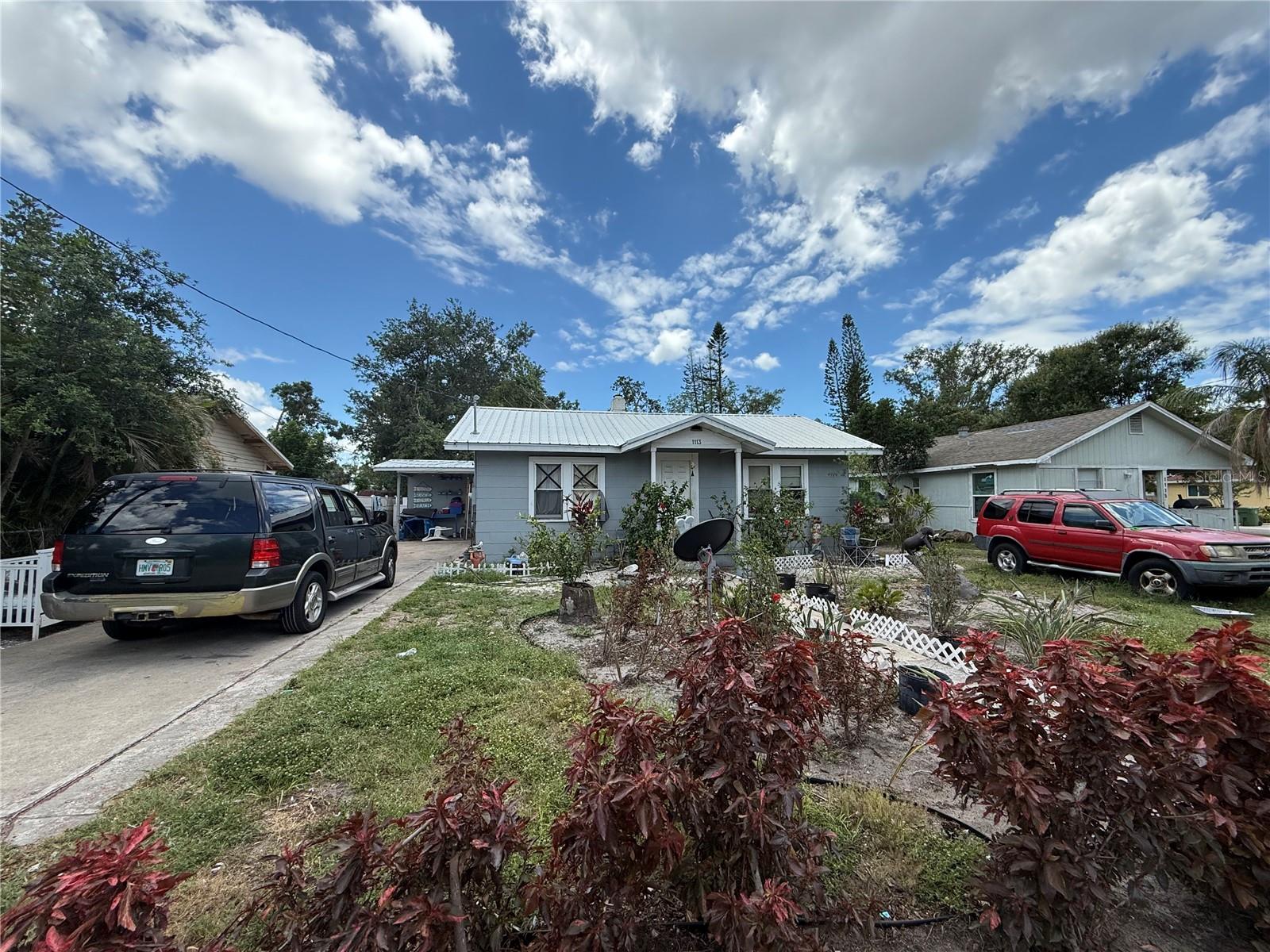 Cottage style home with two bedrooms, combo living-dining space and large kitchen. New metal roof. Enclosed porch area for extra living space. New metal roof. Convenient central location. Currently leased month to month for $1,100....well under market rate. Keep as investment property, fix and flip, or make it your home! Call today.