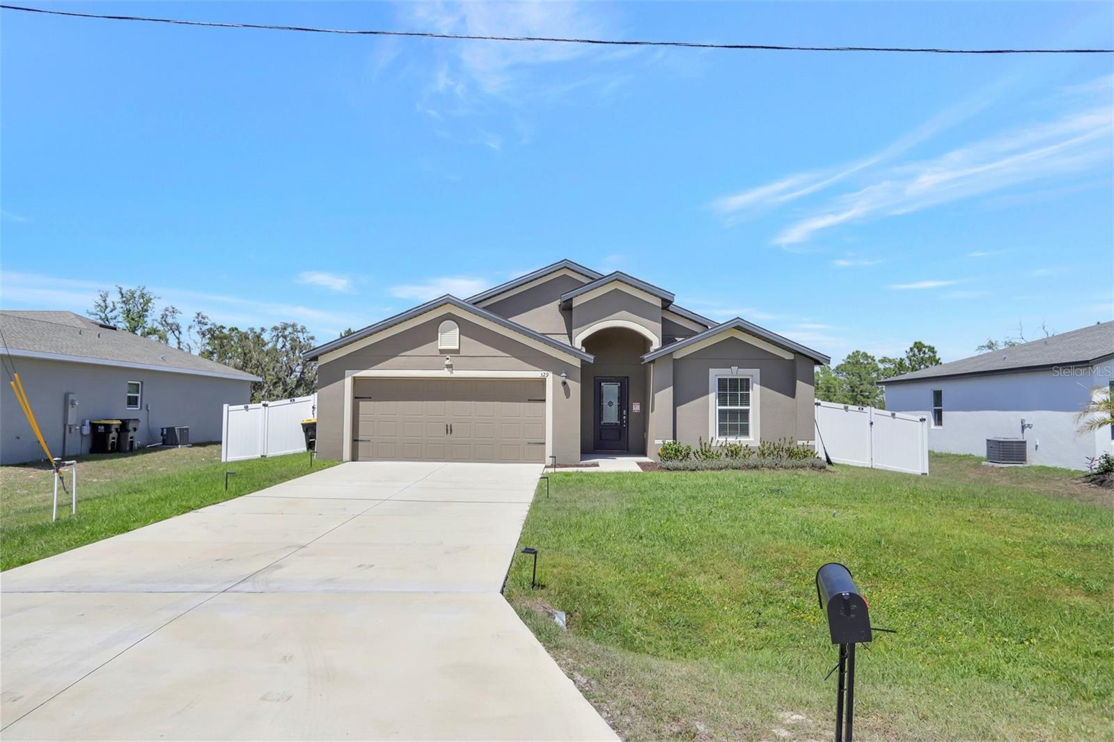 Welcome to your dream home in the heart of Poinciana, Florida! This stunning 4-bedroom, 2-bathroom residence with a Flex Room, built in 2022, offers a perfect blend of modern design and comfortable living. Situated on an oversized 0.32-acre lot with no rear neighbors, you'll enjoy unparalleled privacy and ample space to create your own backyard oasis—imagine adding a pool or hosting gatherings in this serene setting. Natural light floods the living areas, creating a warm and inviting atmosphere throughout the home. Step inside to discover an open-concept floor plan adorned with wood-like tile flooring and a neutral color palette, allowing you to personalize the space effortlessly. The kitchen is a chef's delight, featuring granite countertops, stainless steel appliances, a large breakfast bar, and upgraded fixtures with a new dishwasher installed April 2025. The primary suite offers a tranquil retreat with a walk-in closet and an en-suite bathroom boasting dual vanities, granite countertops, a soaking tub, and a separate shower. Additional bedrooms are spacious and well-appointed, providing comfort for family and guests alike. Outside, the extended driveway and fully fenced yard with dual gates provide convenience and security. Enjoy the covered rear lanai, perfect for relaxing or entertaining. The home also includes an upgraded water softener system and Vivint security system, complete with video doorbell, cameras, and sensors, offers peace of mind, and the owners will pay off the balance at closing. Located within the Association of Poinciana Villages, residents benefit from low HOA fees that include high-speed internet and cable. The community boasts an array of amenities available such as pools, fitness centers, parks, and recreational facilities, enhancing your lifestyle (fees required). Positioned in a prime Central Florida location, you'll be able to make the most of experiencing world-renowned attractions like Walt Disney World and Universal Studios, as well as a variety of shopping, dining, and entertainment options nearby in Winter Park, Orlando, Champions Gate and more! Contact me today to schedule a private tour and make this dream home yours! Other: Roof, AC, Water Heater 2022; New Dishwasher (April 2025); Fence 2023; Water Softener System 2023.