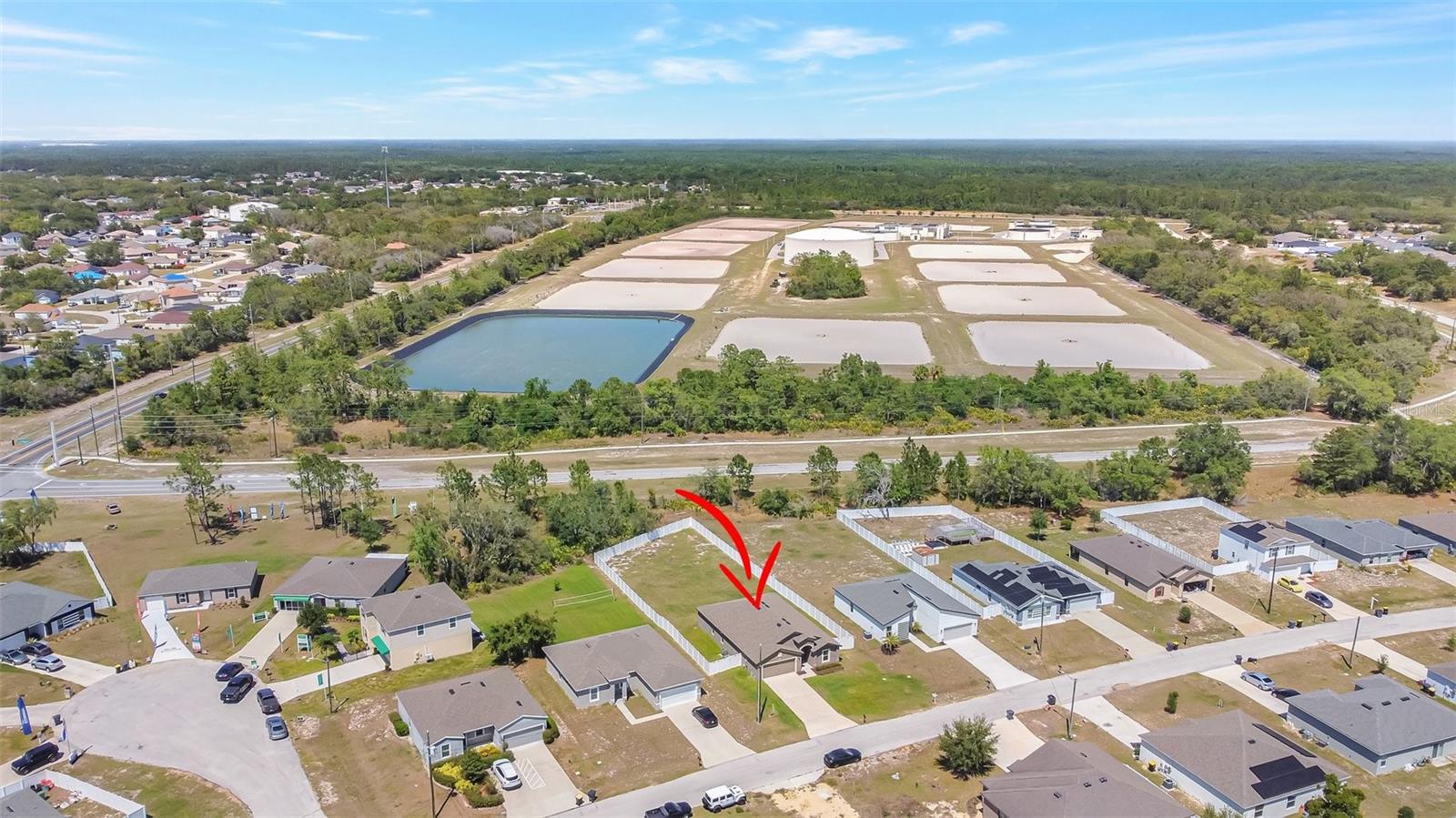 Out in the heart of Poinciana, there’s a place that feels like home, four beds, two baths, a flex room too, built in 2022 and still shining like new. On a third of an acre with no neighbors behind, it’s just you, wide open skies, and peace of mind. There’s plenty of room for a backyard dream—a pool, a firepit, or a Sunday barbecue scene. Step on in and sunlight pours through, wood-look tile and walls so true, with an open floor plan where life runs free and a kitchen that’s made for your family. Granite counters, stainless steel, and a breakfast bar where the mornings feel real. A brand-new dishwasher and upgrades throughout—this is the kind of home you sing about. The primary suite is your getaway with a walk-in closet and a bath where worries fade away. Dual vanities, granite tops, a soaking tub where the world just stops. Two more bedrooms with walk-in closets and an updated guest bath mean everyone’s got their own space. Out back there’s a fenced yard with gates so wide, bring your boat, your truck, you’ve got nothing to hide. A covered lanai where the evenings fall, friends and family, you can host them all. Peace of mind comes in every line, with a roof, AC, and water heater all from 2022. The fence is new, the water softener too, and Vivint security is watching over you. In Poinciana Villages, life feels sweet, with a low HOA, cable, and internet complete. Pools and parks, fitness neaarby too—everything you need is waiting for you. And when the weekend rolls around, Disney and Universal are close to town. Orlando lights, Winter Park nights, and Champions Gate all feel right. This isn’t just a house, it’s the dream you’ve been chasing. Schedule your tour—there’s no time for waiting.