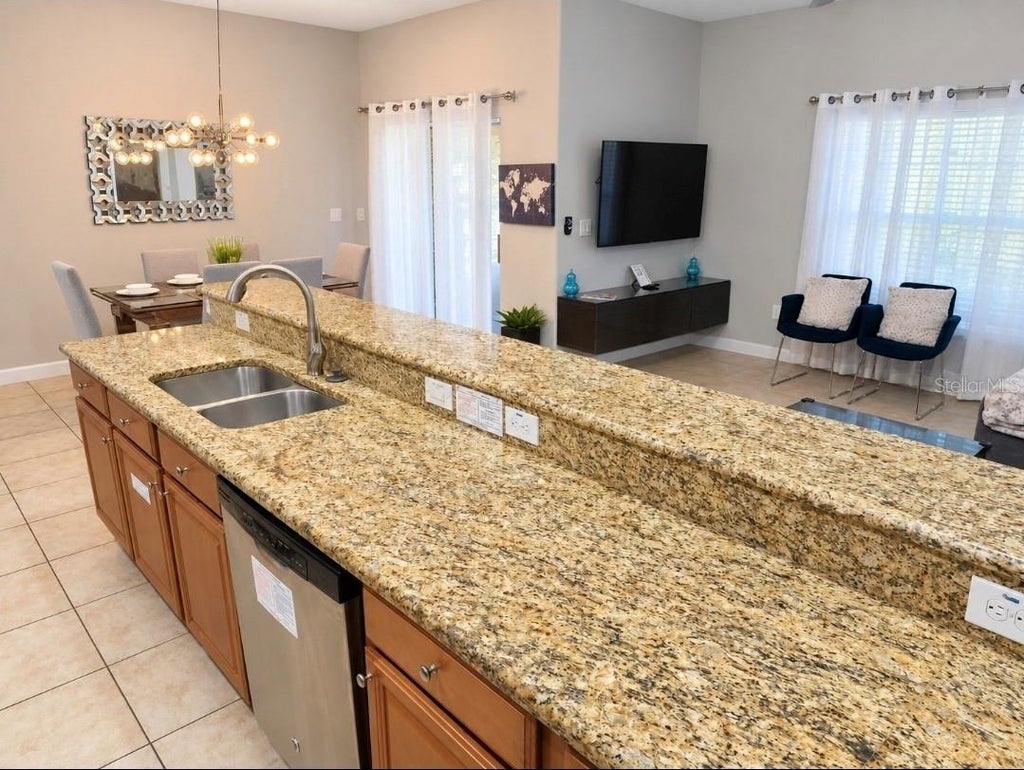 Photo of 8961 Bismarck Palm Rd, Kissimmee, FL 34747 (MLS # O6449007)