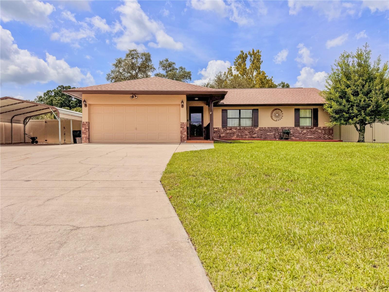 Welcome to Your Private Oasis! This stunning 3-bedroom, 2-bath resort style pool home offers 1,750 sq. ft. of beautifully charming living space with over 30K IN RECENT UPGRADES and sits on .31 acres with 2022 shingle ROOF and GUTTERS, BRAND NEW A/C (JUNE 2025) and BRAND NEW VINYL FENCING. The exterior and interior were freshly painted in 2024. Relax and recharge in your private backyard oasis which features a resort style pool and heated spa (resurfaced in 2021) and well manicured landscaping. Inside you’ll find an updated kitchen featuring sleek stainless-steel appliances renovated in in 2021 with new cabinets, appliances and granite countertops. A newer hot water heater (2023) ensures efficiency and reliability. New luxury vinyl flooring installed in 2024 throughout the living room and bedrooms. As you exit the dining room through the sliding doors you will enter a bonus room that has a 2021 mini-split with heat pump/AC and features upgraded vinyl windows installed in 2021. Conveniently located near supermarkets, restaurants, downtown Ocala and retail shopping, this home blends tranquility with accessibility. With over $30K in RECENT UPGRADES, don’t miss the chance to call this poolside paradise yours—schedule a showing today!