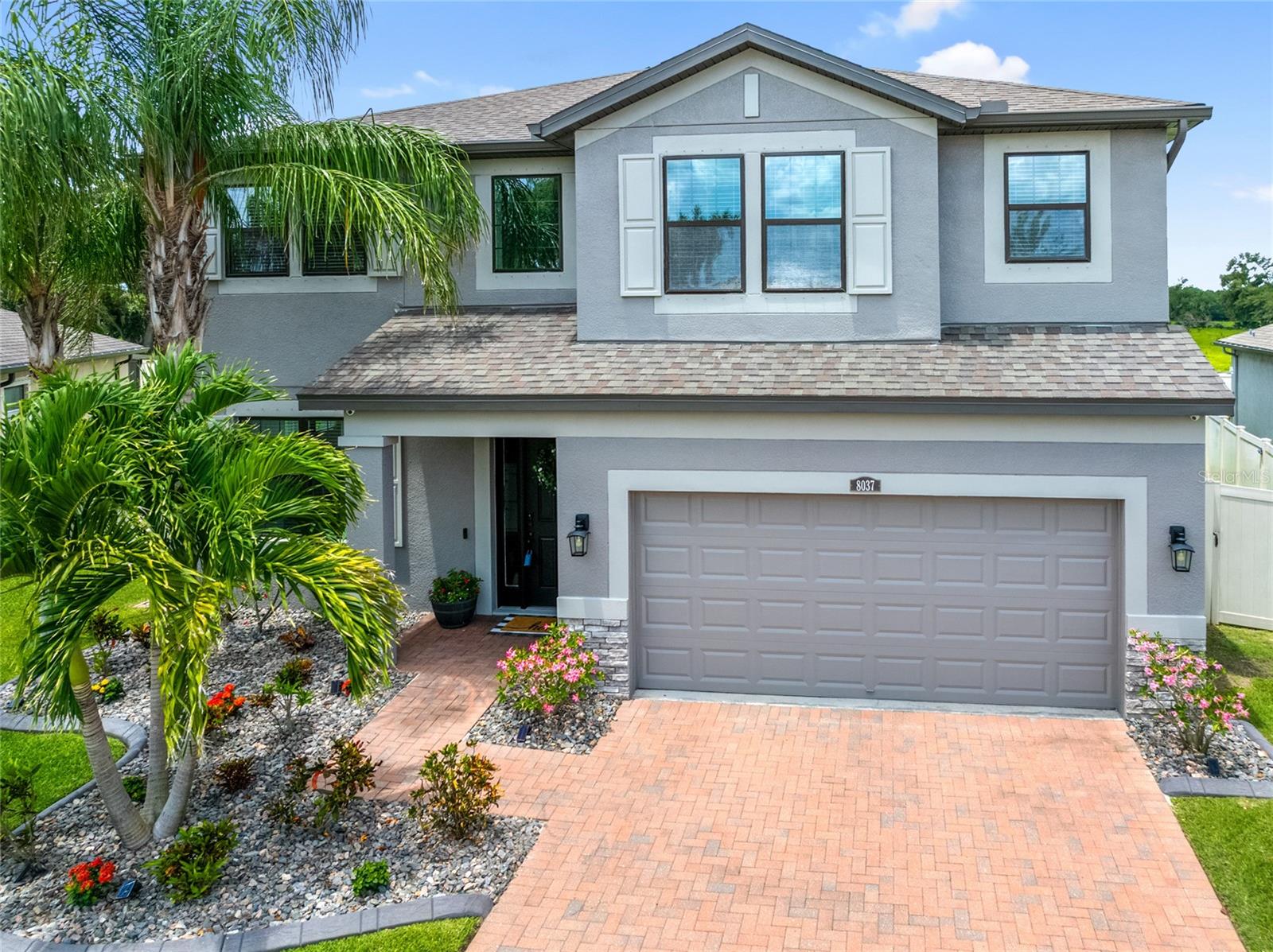 Welcome to this impeccably maintained 5 bedroom 3 bath POOL home located in the desirable gated community of Arbor Park in Riverview—a rare find! Offering over 3,500 square feet of living space and a 1/4 acre lot, this residence features a spacious, well-designed layout with multiple living areas, upscale finishes, a upstairs loft/media room and smart home upgrades—perfect for comfortable living and effortless entertaining. As you enter the home, you are greeted by the high ceilings and abundant natural light. The kitchen has been upgraded with high end appliances, quartz counters and built in double oven. The walk in pantry has plenty of space for all your cooking and entertaining essentials with custom design and shelving as well. A butler's pantry across from the pantry is the perfect blend of elegant and casual with it's many functions and uses. An extended cabinetry into the dining room—including a beverage fridge and matching quartz countertops brings the elegance beyond the kitchen and is perfect for hosting. You will also love the oversized island as the heart of the home. The open floor plan then flows into the family room which includes HURRICANE sliders that open completely to the patio and pool area. Downstairs you will also find a bedroom with full bath, ideal for your guests. An upstairs Primary Suite is generously sized and includes a custom closet and upgraded Primary bathroom features. The other 3 bedrooms are situated in a split floor plan and also include custom closets by Closets by Design. The show stopping laundry room is complete with custom cabinetry and quartz surfaces. Step outside to your private backyard oasis, featuring a heated SALTWATER pool with a large sunshelf, travertine tile deck, nebular lighting around the pool cage and plenty of covered outdoor seating—perfect for the Florida lifestyle. There are no backyard neighbors creating complete privacy. This home is also packed with upgrades: OWNED solar panels, a whole-house generator switch, electric vehicle charging outlet, USB-integrated outlets, new water heater, water softener, and fresh exterior paint. Seller is offering a $5000 concession toward new flooring upstairs. Located in a peaceful, quiet neighborhood just minutes from the Crosstown Expressway and I-275, you are close to shopping, dining, Downtown Tampa and MacDill AFB. You must see to appreciate the details of this home - schedule your showing today!