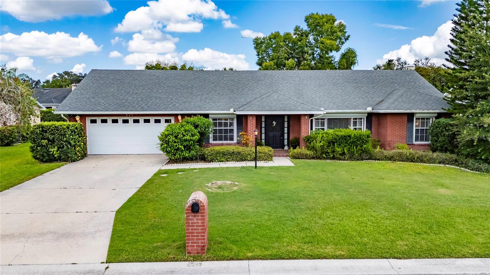 Located in the highly sought-after gated community of Scott Lake West in South Lakeland, this beautifully updated traditional brick home sits on a quiet cul-de-sac and offers over 2,475 square feet of well-designed living space. With 3 bedrooms, 2 bathrooms, and a large dedicated office (currently used as a playroom), this move-in ready home is filled with upgrades inside and out.
Step inside to find vaulted ceilings, fresh interior paint (2024), new luxury vinyl plank flooring throughout the foyer, living room, dining room, family room, kitchen, and office/playroom, plus new carpet in all three bedrooms. The spacious family room features a cozy wood-burning fireplace, while the formal dining room and office retain classic parquet floors.
The renovated kitchen (2024) boasts brand-new Whirlpool stainless steel appliances—including range, dishwasher, and refrigerator—solid surface Pegasus countertops, freshly painted cabinets with updated hardware, a new sink, reverse osmosis filtration system, and an eat-in breakfast nook perfect for casual dining.
The primary suite has been transformed into a spa-like retreat with a Whirlpool alcove soaking tub featuring a silent pump, heat maintenance, Bluetooth music system, and air bath lights, plus a new double vanity, TOTO toilet, Delta Saylor tandem shower heads, and floor-to-ceiling tile.
Practical upgrades include a 2020 air handler, 2007 condenser, new water heater (2024), exterior paint (2024), and a full-house Westinghouse dual fuel inverter generator (2024). Additional highlights include an oversized two-car garage with an extra refrigerator, a dedicated laundry room, a large private backyard with irrigation, smoke detectors, and an active Ring security camera system. Roof 2015.
Scott Lake West is known for its quiet streets, family-friendly atmosphere, low HOA, and unbeatable South Lakeland location close to top-rated schools, parks, shopping, dining, and the new hospital campus coming soon.