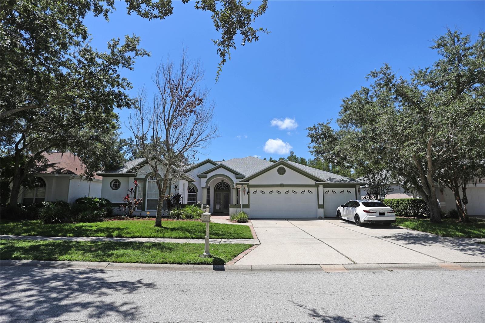 Stunning One-Story Home with Detached Casita in Guard-Gated Resort Community. Welcome to this exceptional 5-bedroom, 4-bathroom residence featuring a 3-car garage and an inviting detached casita complete with a full bath, closet, and private entry—perfect for guests, in-laws, or a home office. Step inside to discover a bright, open layout and a spacious chef’s kitchen equipped with stainless steel appliances, a center island, elegant 42" cabinets, and a brand-new vent hood (2023). Roof was replaced in 2023. The living and dining spaces flow seamlessly to the covered lanai, where you can relax and enjoy serene pond views. The home is located in a nice man-guarded gated community offering resort-style amenities, including a sparkling pool, tennis courts, fitness center, and scenic nature trails. This rare combination of luxury, comfort, and convenience is move-in ready and waiting for you.