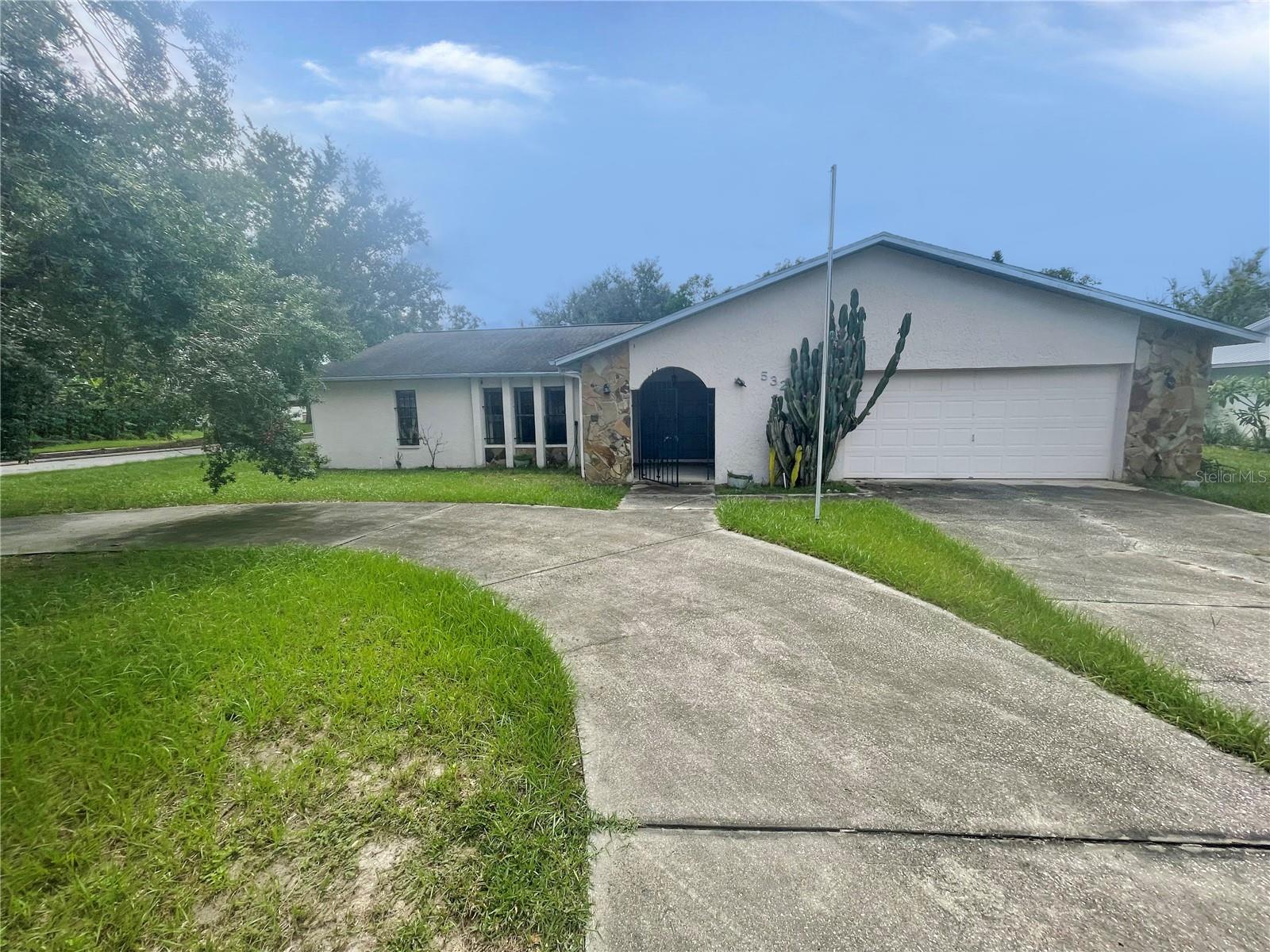 Great POOL Home Opportunity in Lakeland ~ No HOA. No CDD on Corner Lot! This 1979 built home offers 3 bedrooms, 2 bathrooms, 2179 square feet and fully fenced backyard. An open layout welcomes you with a formal living room at the entry directly off of the kitchen/dining/family room combination. Step further inside to the family room with wood burning fireplace - perfect for those cooler Florida nights. Kitchen is situated directly off the family room and is ready for a new owner to make their own. Views of the fenced backyard and inground screened pool can be enjoyed through the sliding doors. The primary suite includes a built-in closet and en-suite ready to make into a peaceful oasis. The secondary bedrooms are tucked away for added privacy and share a full bath. With no HOA or CDD fees and the location is fantastic for commutes to Orlando or Tampa. It's good to be home.