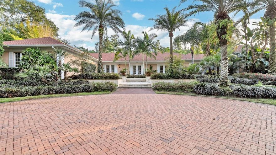 Experience elevated living in this beautifully designed home, set within the exclusive community of Mountain Lake. Tucked away along a private, tree-lined drive, this serene property spans nearly two acres of lush, manicured grounds, offering exceptional privacy. Renovated in 2012, the home features a stylish, Tuscan-inspired kitchen with granite countertops, a gas range, and an open layout perfect for entertaining. Sun-filled interiors highlight a well-planned three-bedroom, three-and-a-half-bath design that blends comfort with inviting gathering spaces. The spacious primary suite offers a spa-like bath, dual walk-in closets, a cozy coffee bar, and a private terrace. Outside, enjoy resort-style living with a sparkling pool, screened lanai, pergola-covered patio, and nearby citrus grove. With a new roof installed in 2023, this move-in-ready home delivers the perfect mix of luxury, privacy, and convenience. Schedule your private showing today.