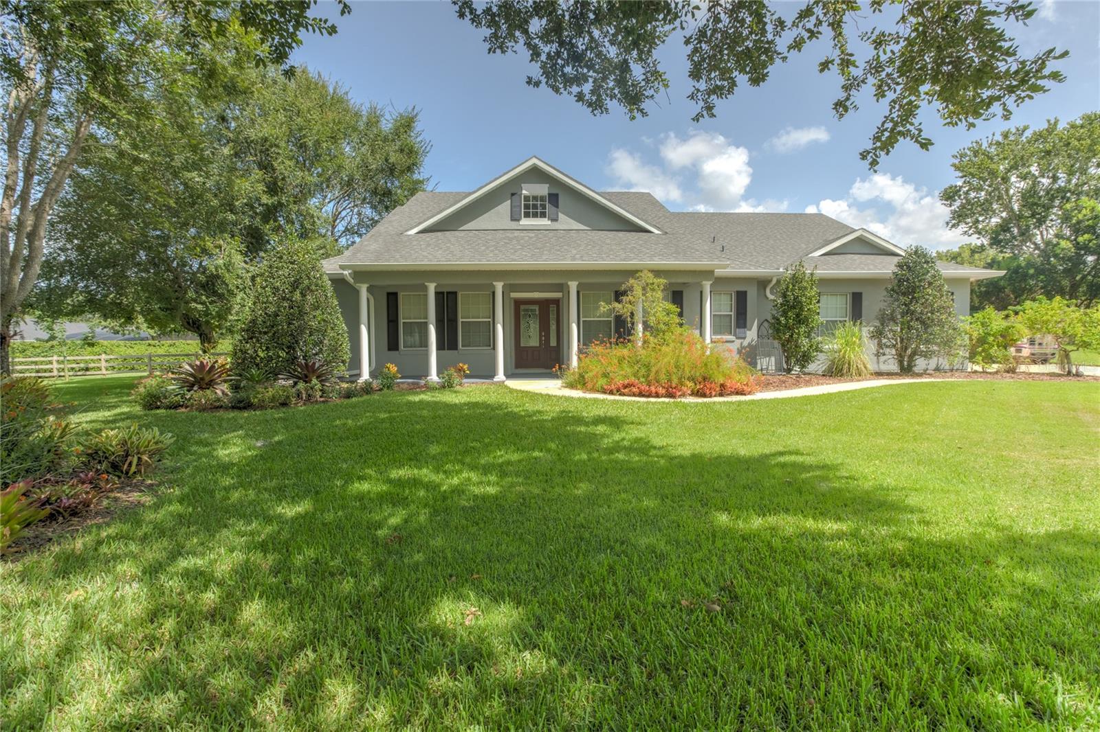 Welcome to this charming Craftsman-style block home, perfectly situated on a spacious 1-acre lot and designed for both comfort and style. Built in 2005, this home features two true master bedrooms, plus an additional oversized room, office, or bonus space. With 3 full bathrooms, everyone has room to spread out. Step inside to find 10’ ceilings, no popcorn, and custom-built-ins in the living room, giving the home a clean and elegant feel. The formal dining room is perfect for gatherings, while the eat-in area off the kitchen adds casual charm. Enjoy cooking in the updated kitchen featuring newer stainless steel appliances and plenty of space for meal prep. The indoor laundry room, epoxy-coated 2.5-car garage, and extra-long driveway provide convenience and storage galore. Major updates include a roof in 2019, A/C in 2021, and brand new exterior paint, making this home move-in ready. Unwind in the expansive screened-in patio, ideal for enjoying peaceful Florida evenings. With 2,014 sq ft of living space and nestled in a serene setting, this home offers the perfect balance of functionality and relaxed elegance. Don’t miss the opportunity to make it yours!