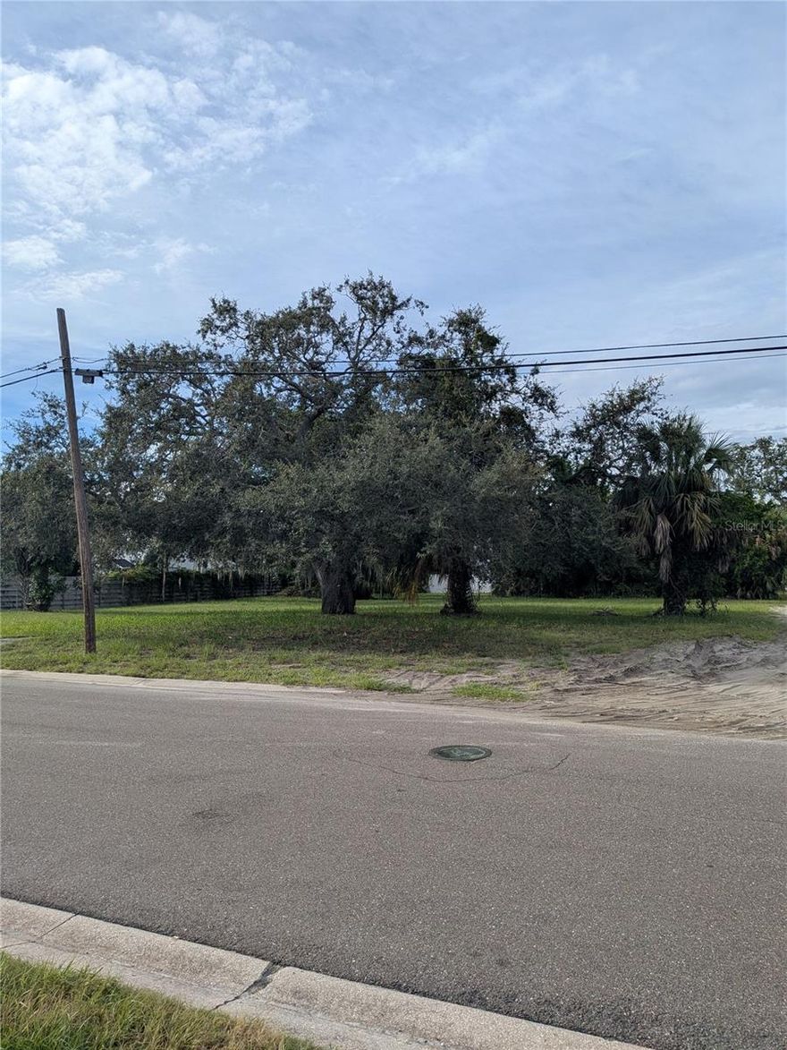 This is a "unicorn" double lot biking distance to eclectic downtown St Pete. Relaxed, quiet area between Lake Maggiore and Tampa Bay's Big Bayou near Pinellas Point. Wildlife Boyd Hill preserve area and park along the lake adds to the "country" feel in the city and another park on 6th Street with boat ramp with saltwater dock, family restaurant and a tavern 2 blocks away.  Almost a half acre perfect for a secluded family compound under the 100 year + bearded oaks. Privacy fenced on two sides and abandoned alley on east which extends usable area if used as driveway. Platted as 60x160 and 50x160 lots that would accommodate two estate homes with accessory dwellings. level and cleared. City sewer and water to site and ready to build now. Special high elevation on a ridge deposited in prehistoric days keeps lot high and dry above the flood zone (Zone X which does not require flood insurance).