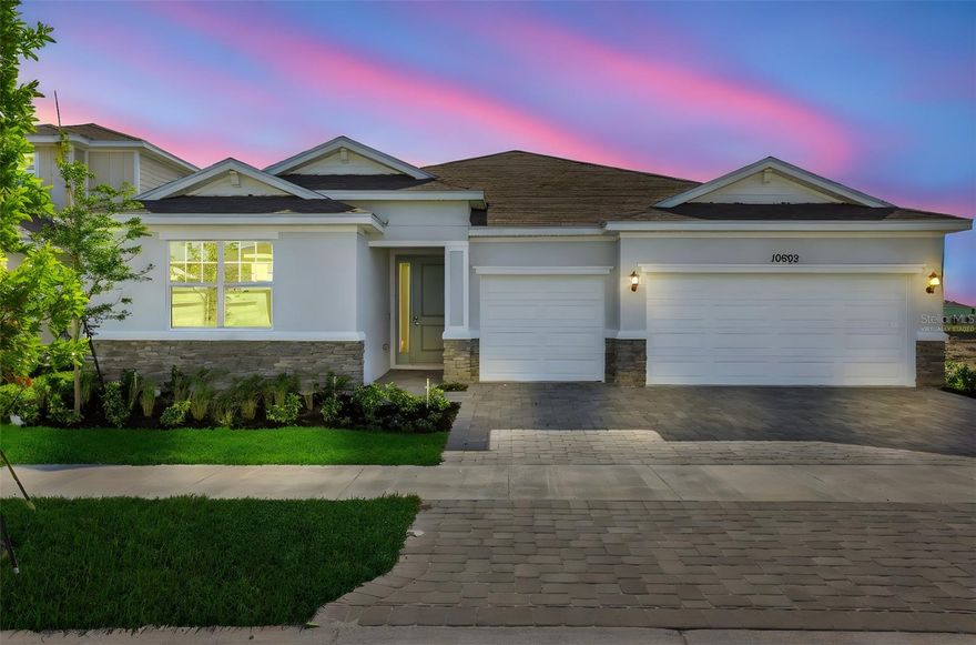 One or more photo(s) has been virtually staged. The Catalina is a stunning single-story home featuring 3 bedrooms, 2 bathrooms, which include double vanity sinks, and a spacious 3-car garage within 2,211 square feet of thoughtfully designed living space. The open-concept kitchen features a large island and seamlessly flows into the living and dining areas, creating a bright and inviting space that is perfect for both relaxation and entertaining. A separate dining space off the great room a more formal setting for meals and gatherings. The primary suite includes an expansive walk-in closet for ample storage and a connected private bathroom. Multiple windows throughout the house fill every room with natural light, enhancing the open and airy feel. A lanai extends your living space outdoors, offering a seamless connection to fresh air and nature.